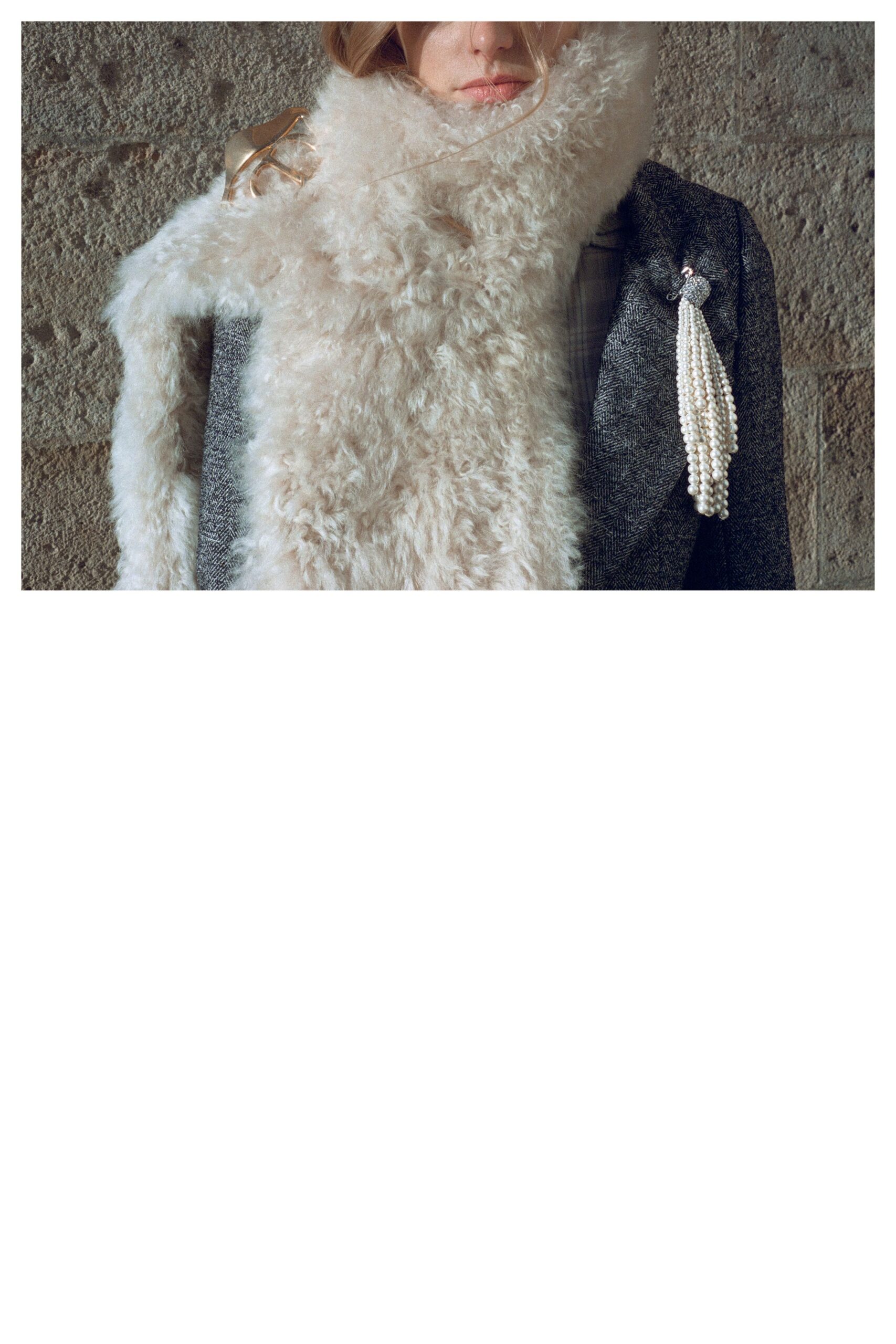 gray tailored blazer with white fur scarf