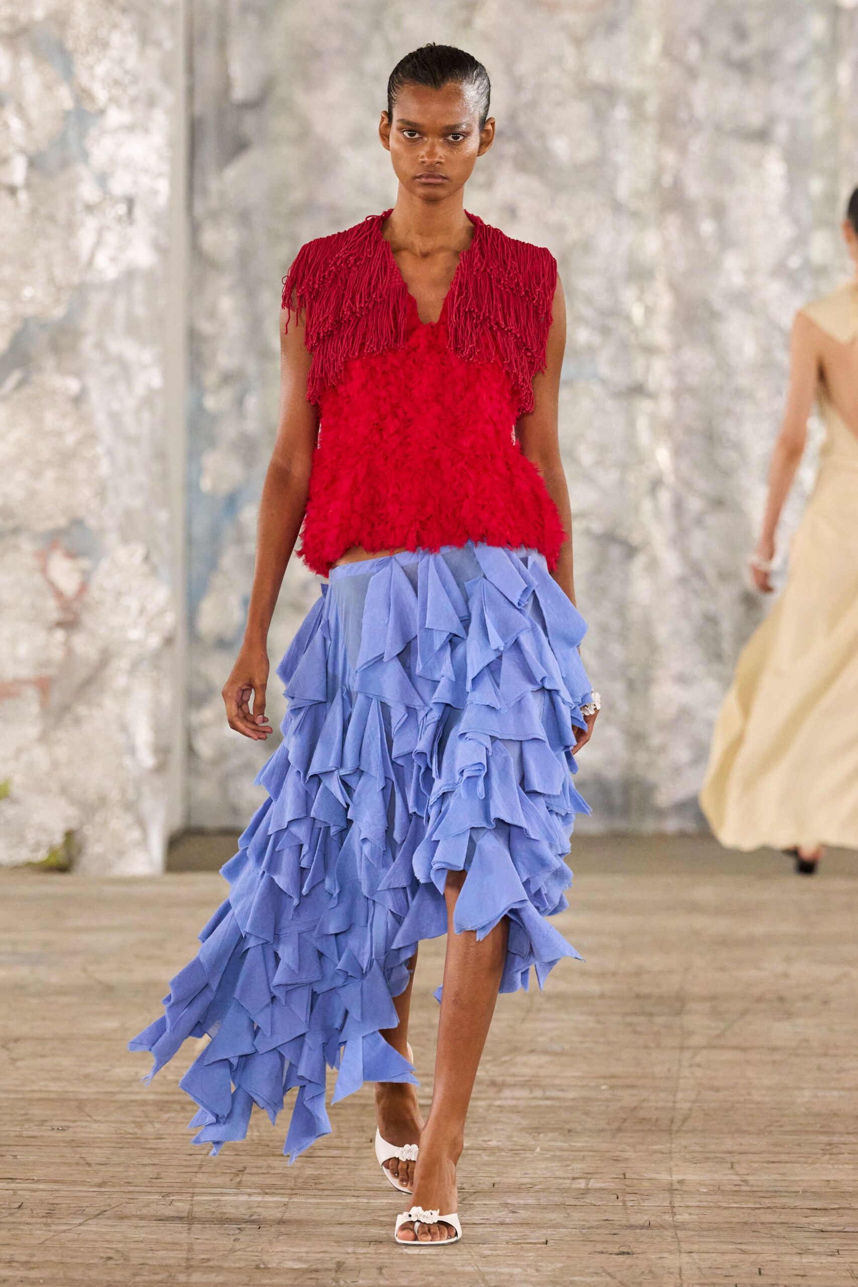 red fringed top blue tiered skirt