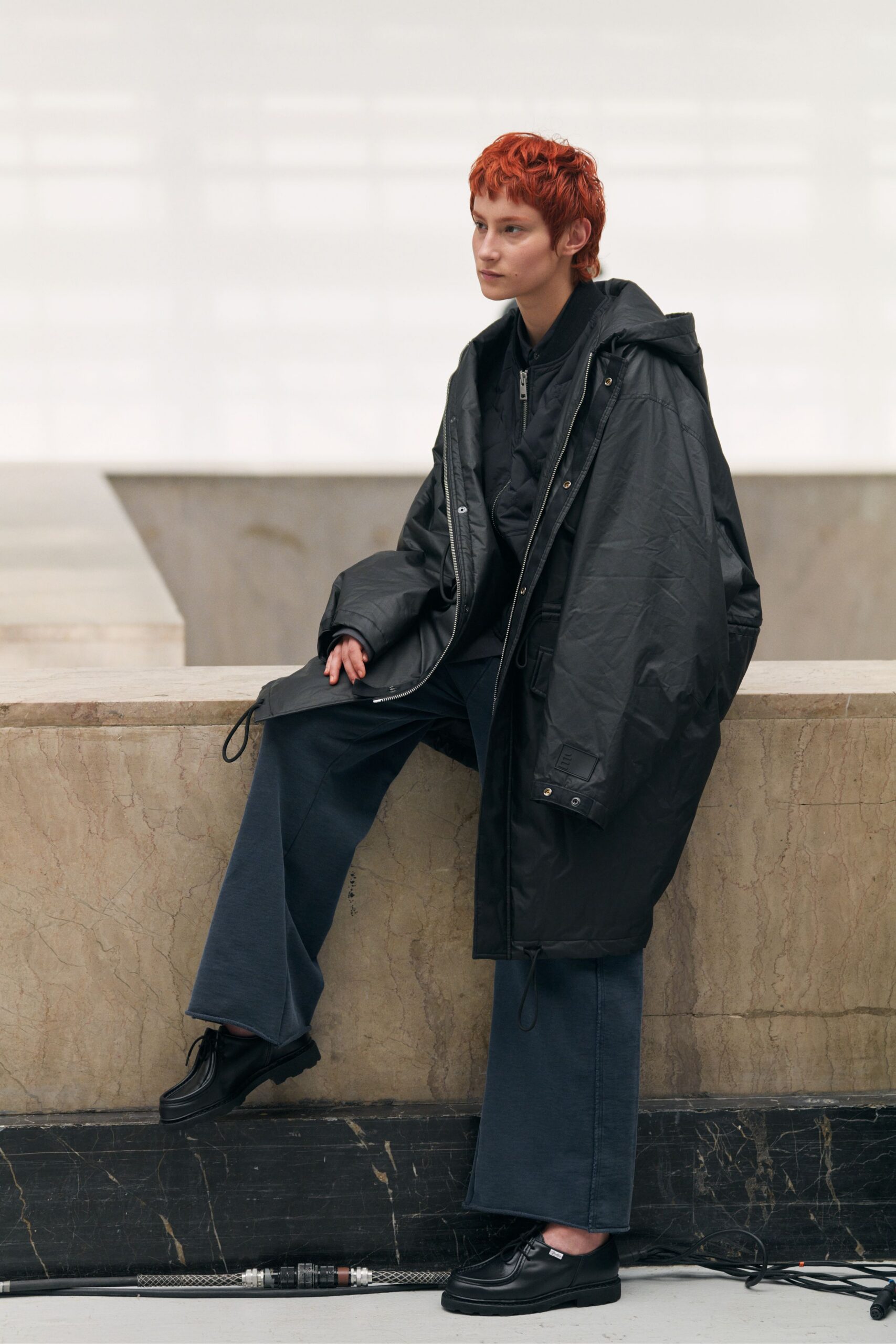 oversized black vinyl coat