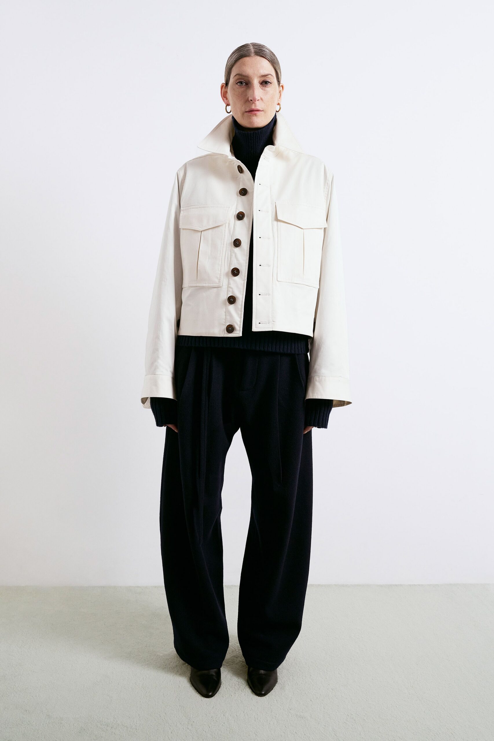 white leather long-sleeve collared fitted buttoned pockets jacket