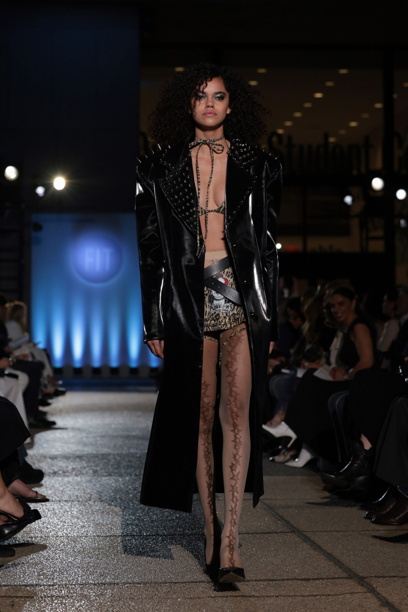 black leather long-sleeve collared fitted zippered pockets coat