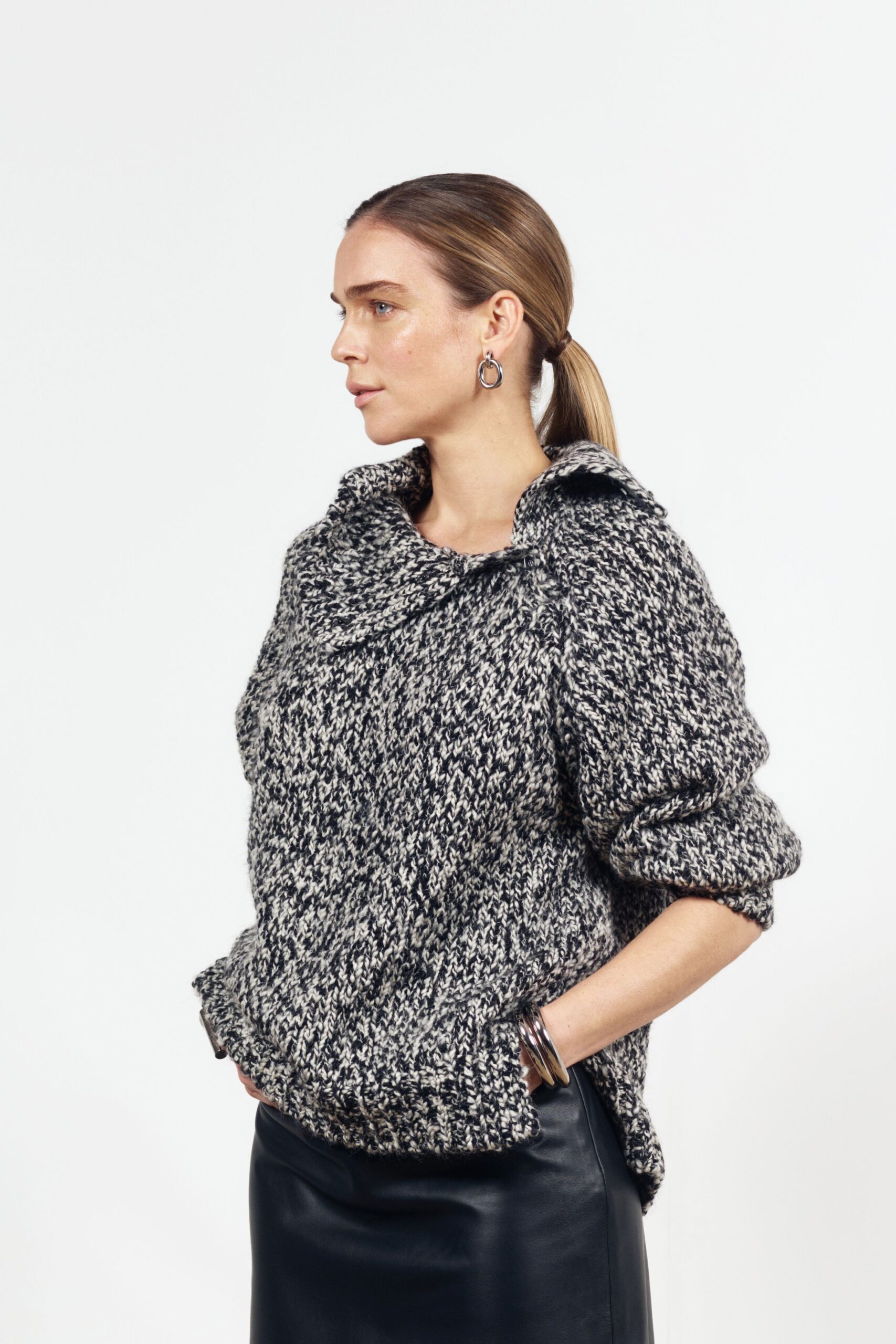 black wool long-sleeve collared relaxed textured sweater