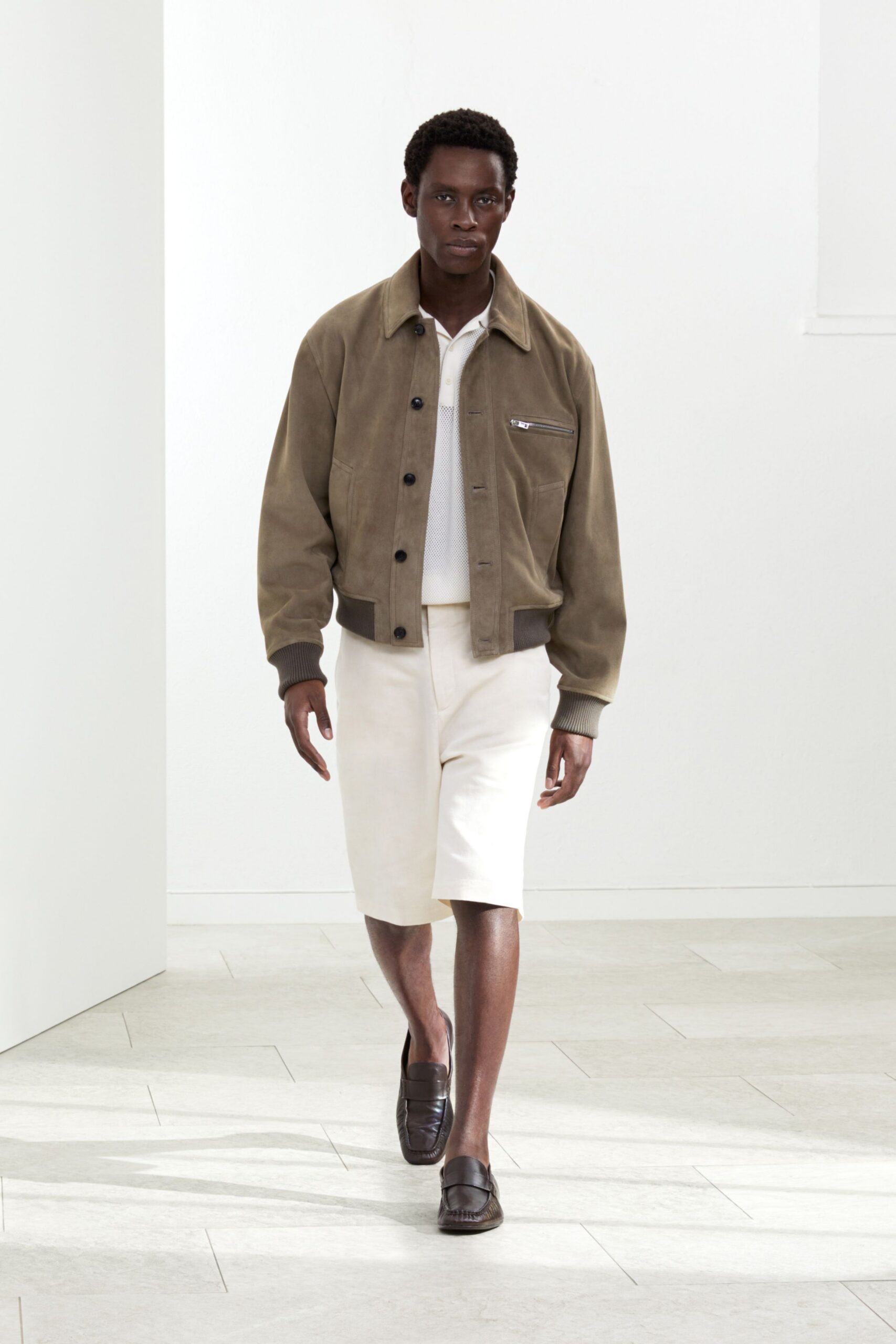 brown suede jacket with beige shorts