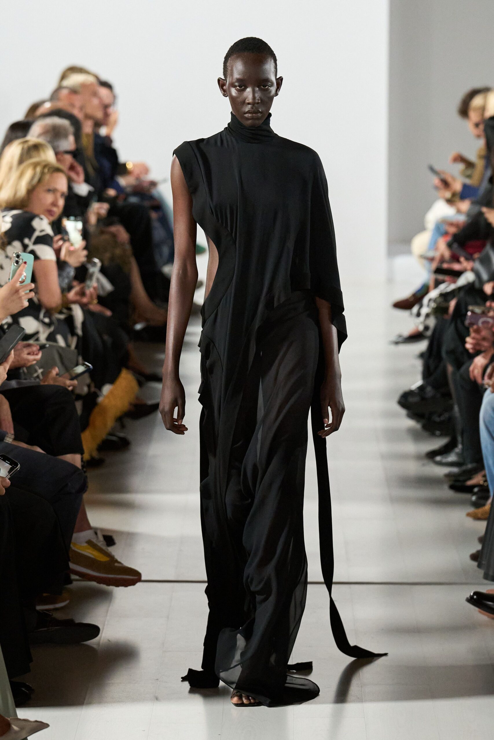 black silk sleeveless high-neck fitted draped flowing dress