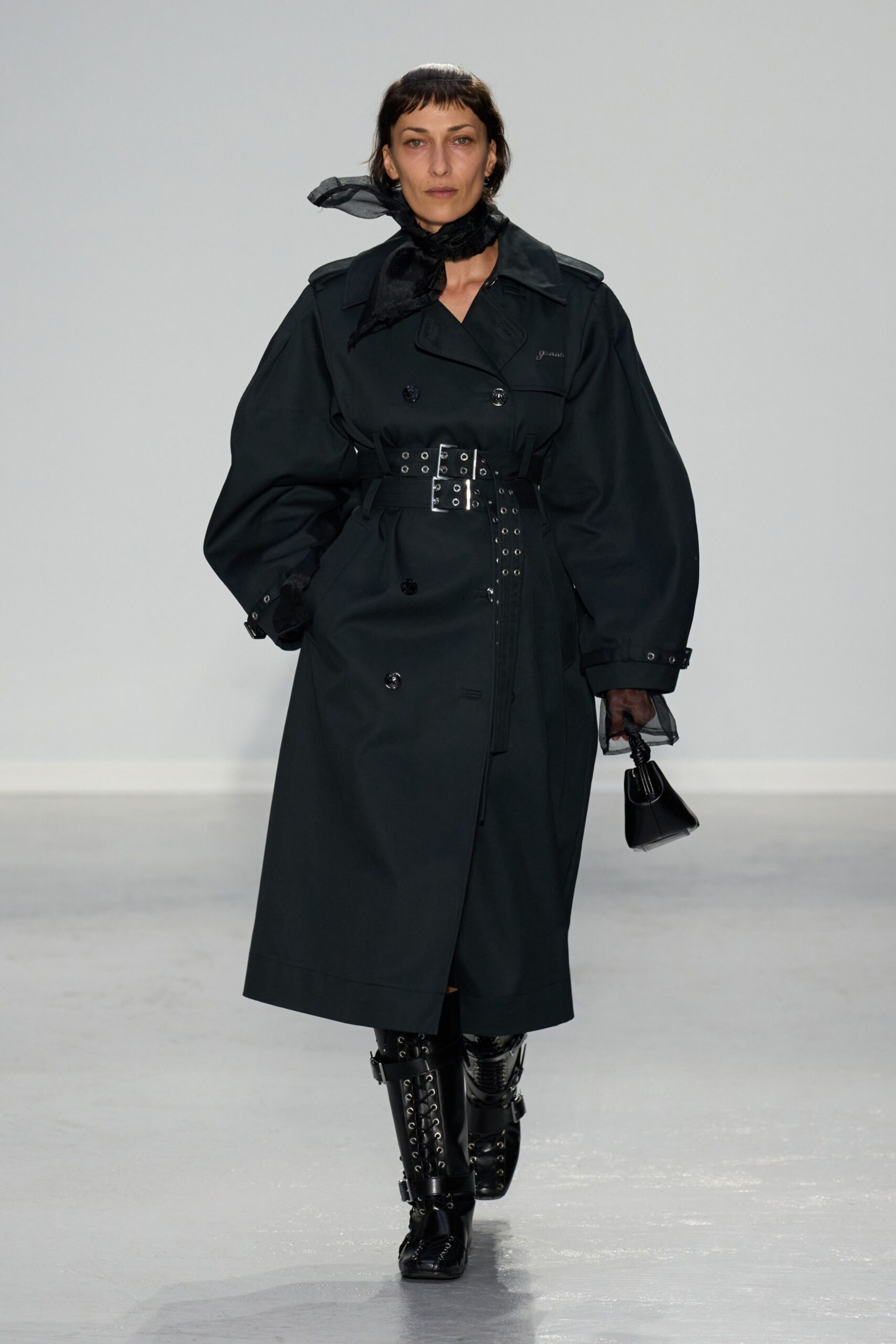 black trench coat with scarf and boots