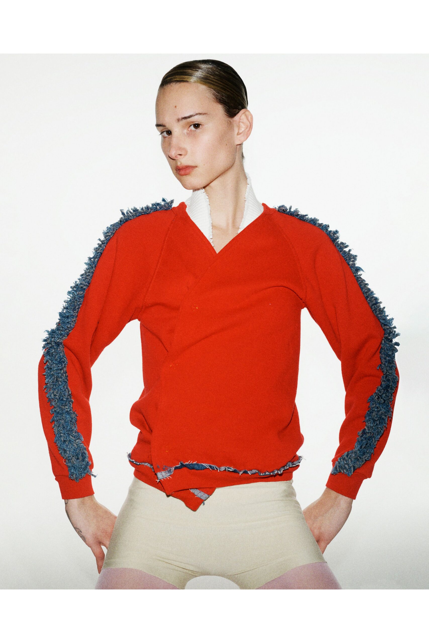 red fitted top with fringed details