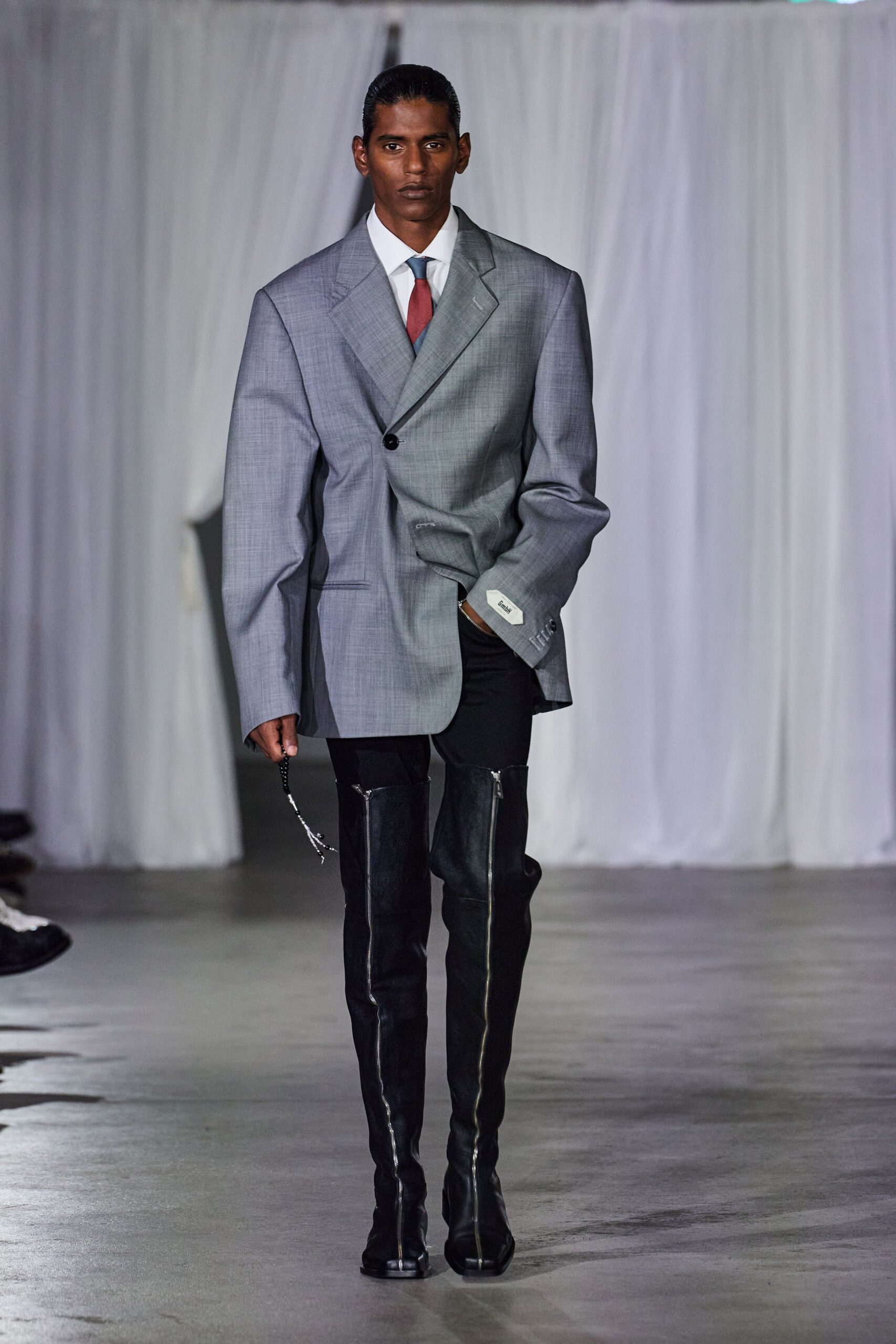 gray oversized blazer with black leather pants