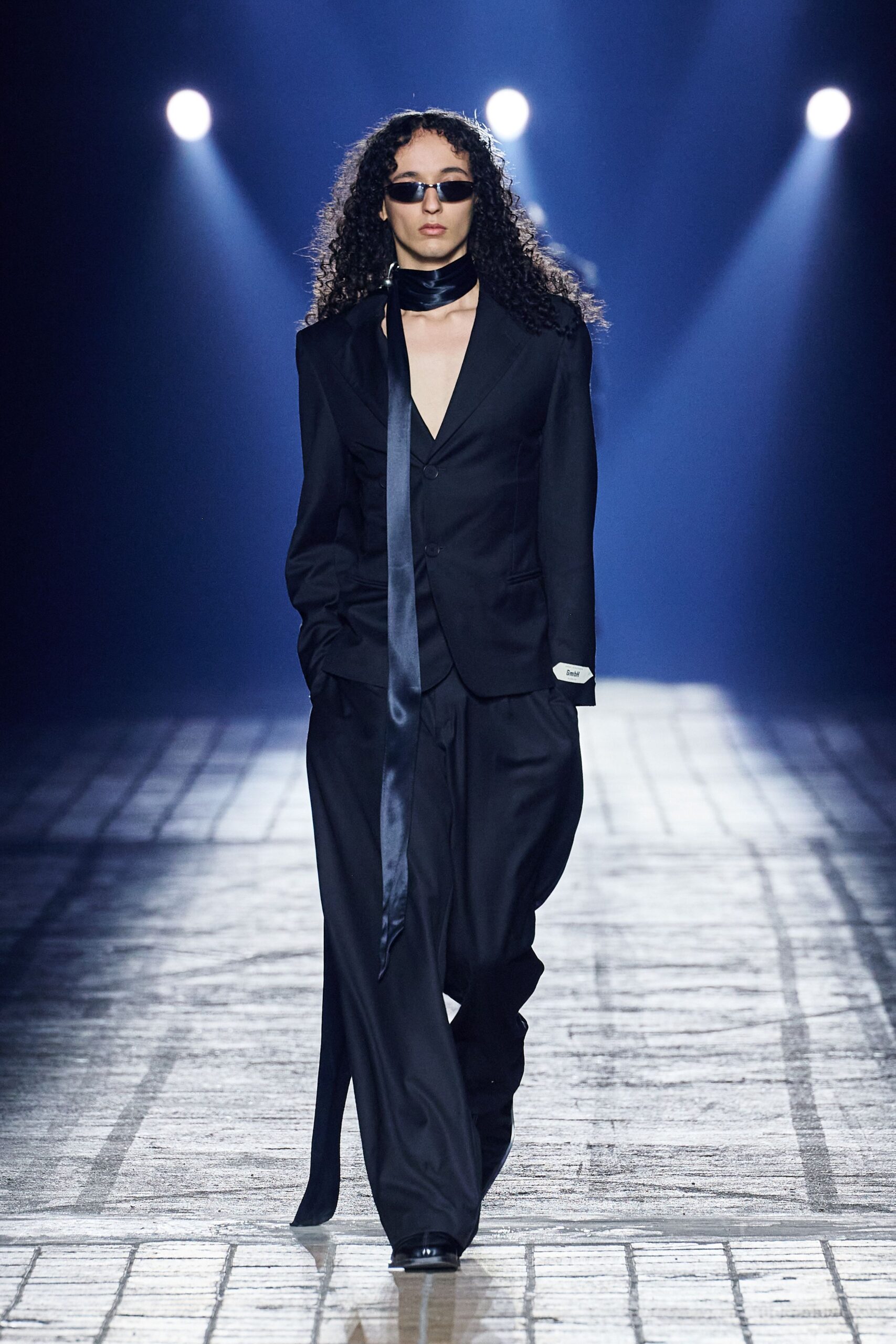 black tailored suit with scarf