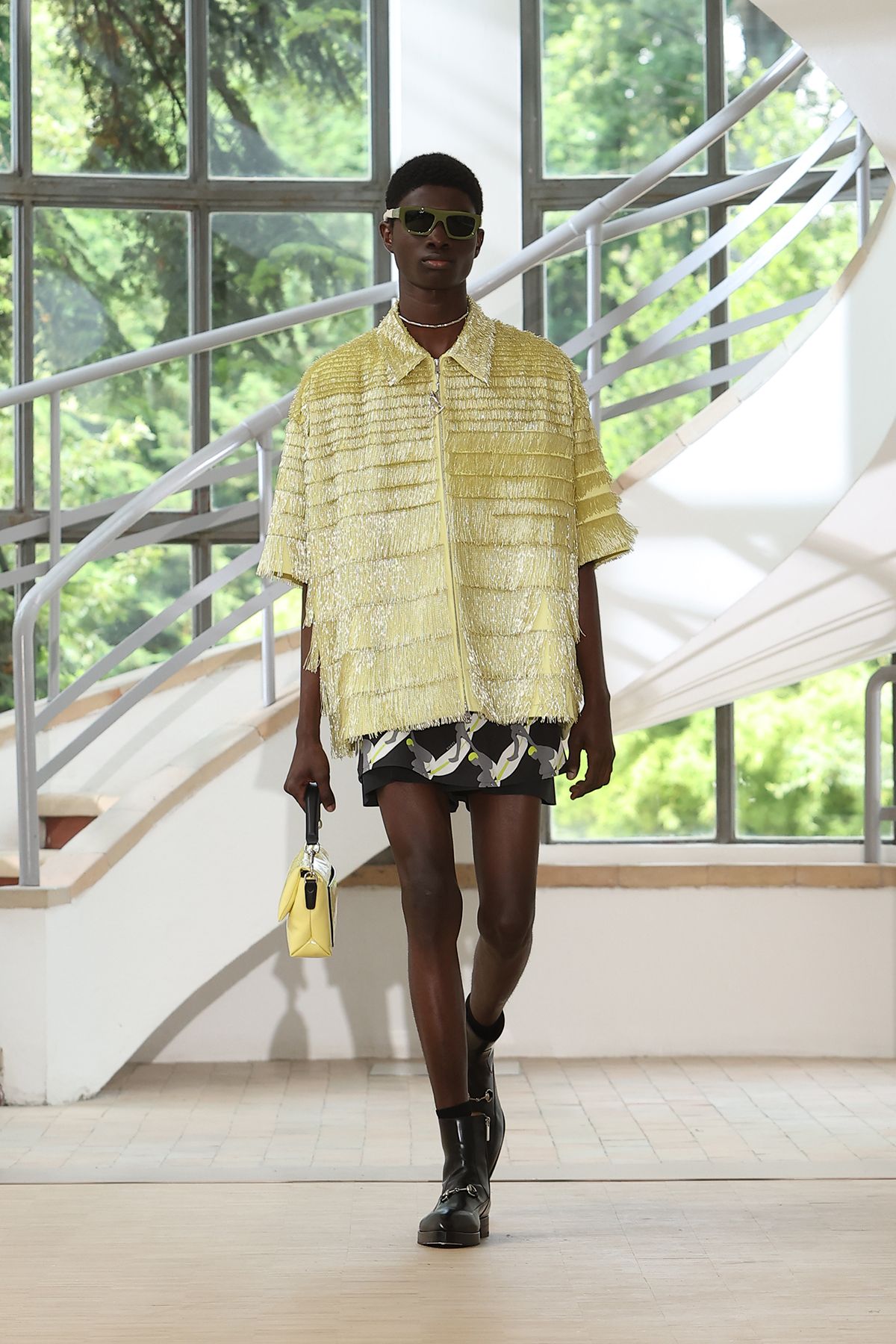 yellow fringed shirt with black shorts