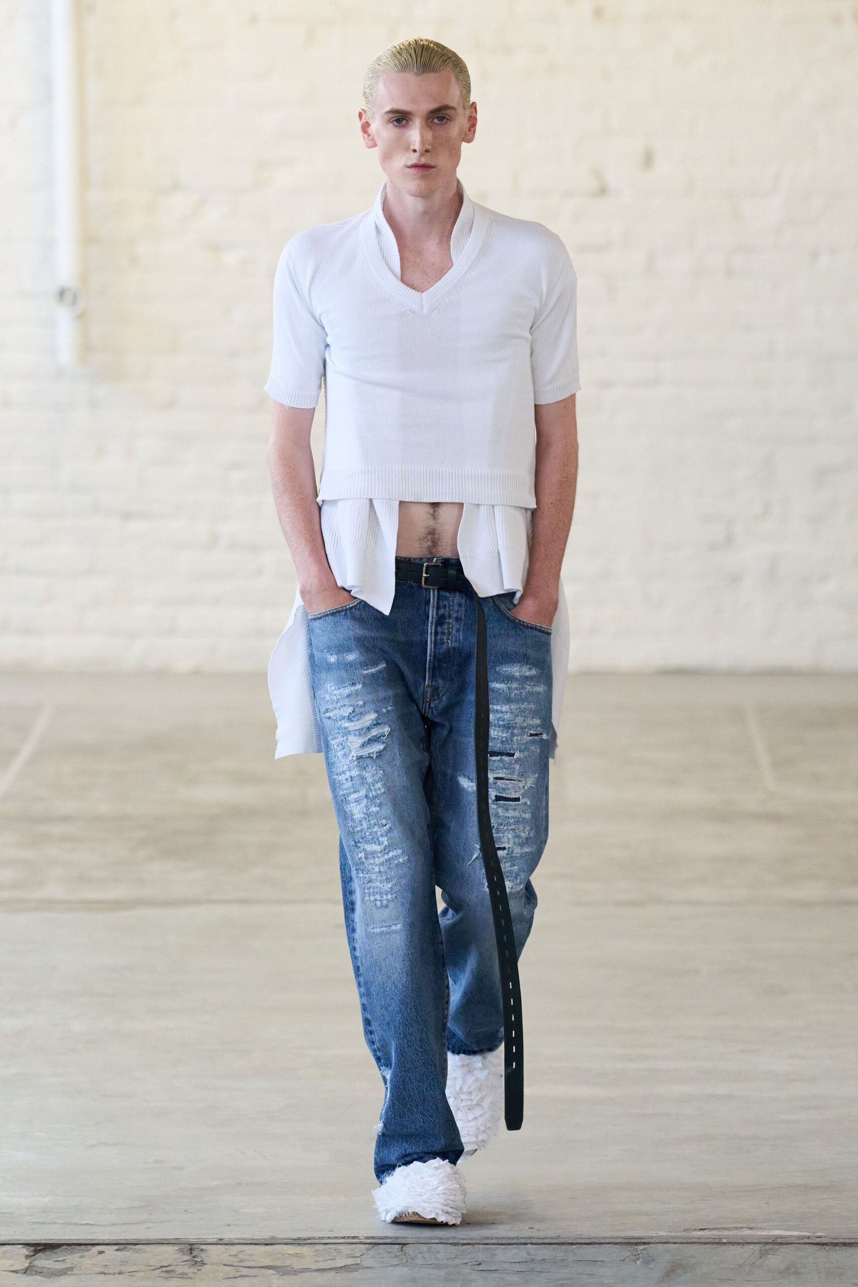 white fitted top with distressed jeans