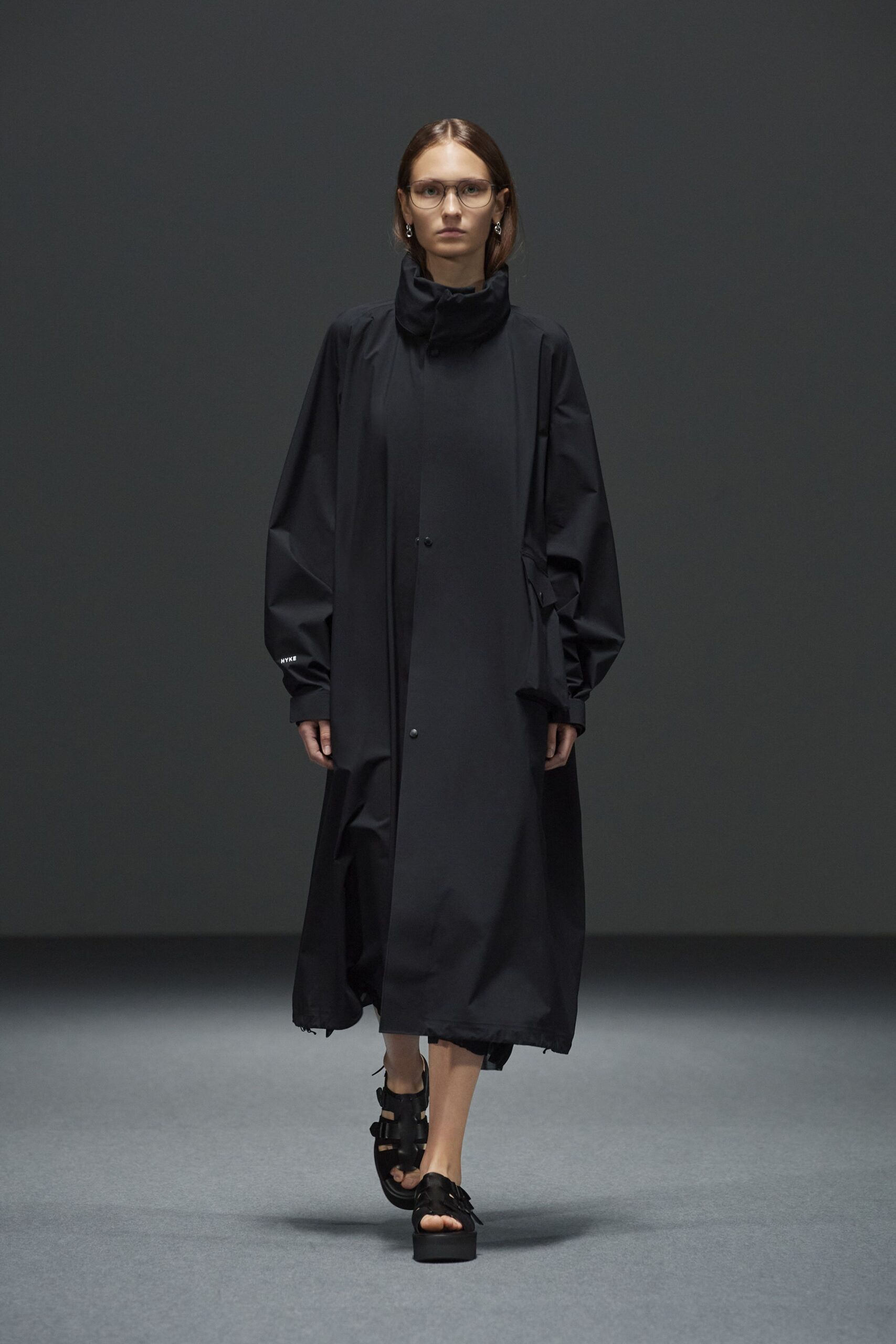 black relaxed coat with chunky shoes