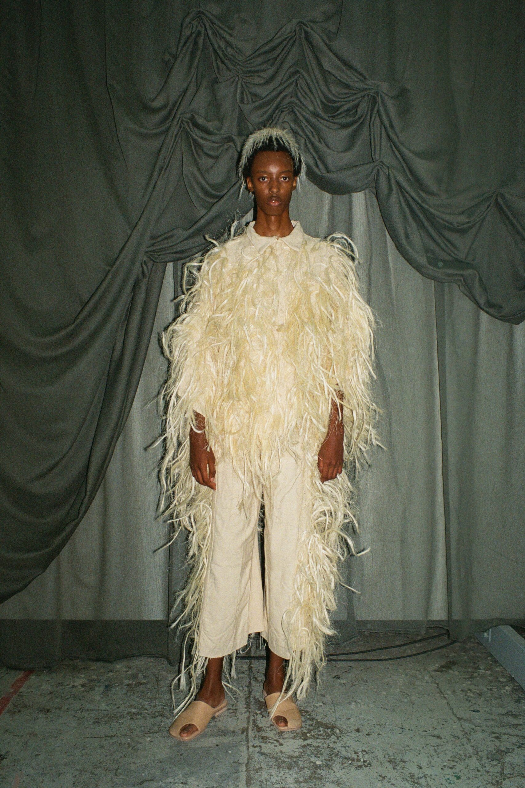 beige fur coat with relaxed pants