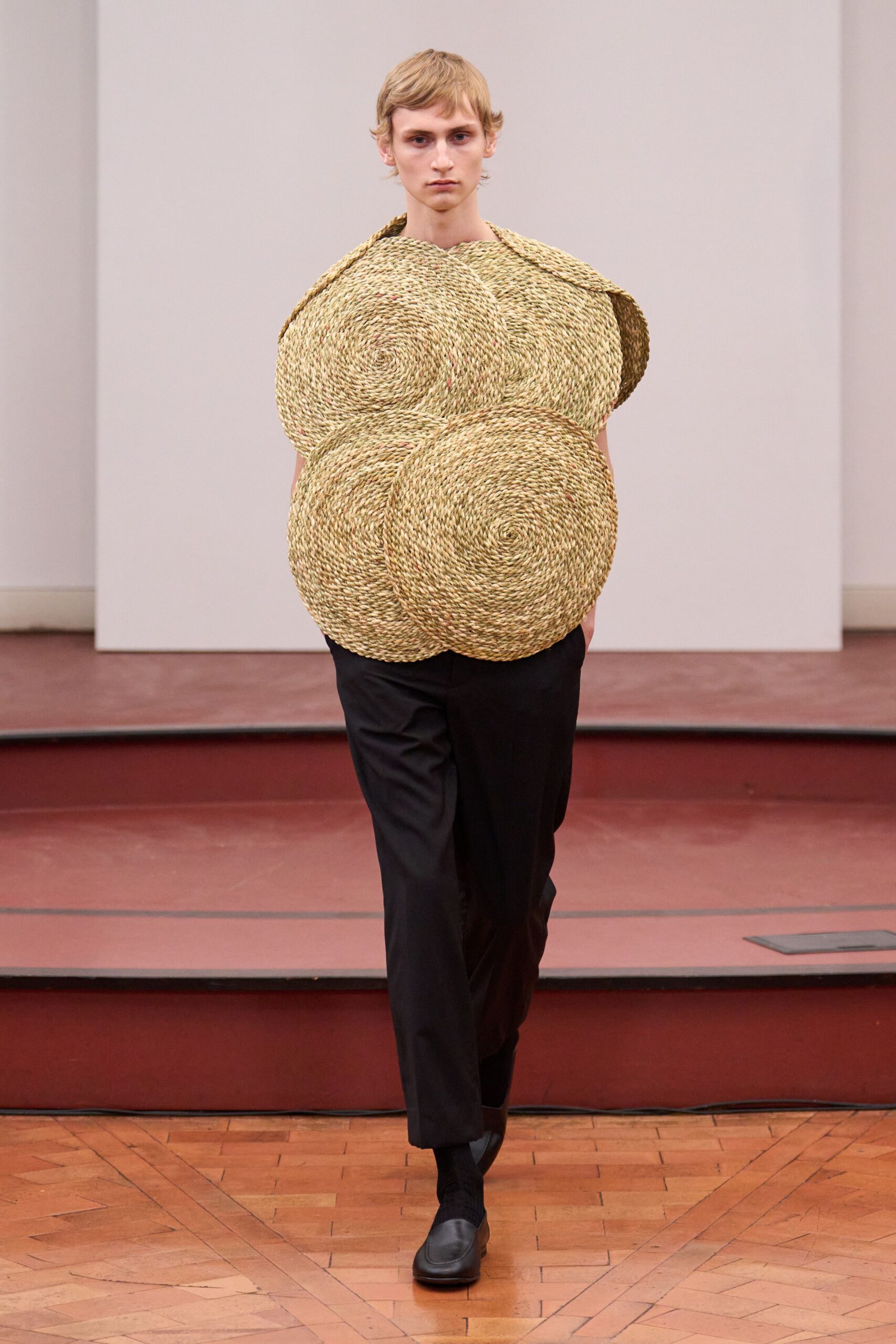beige layered top with black pants