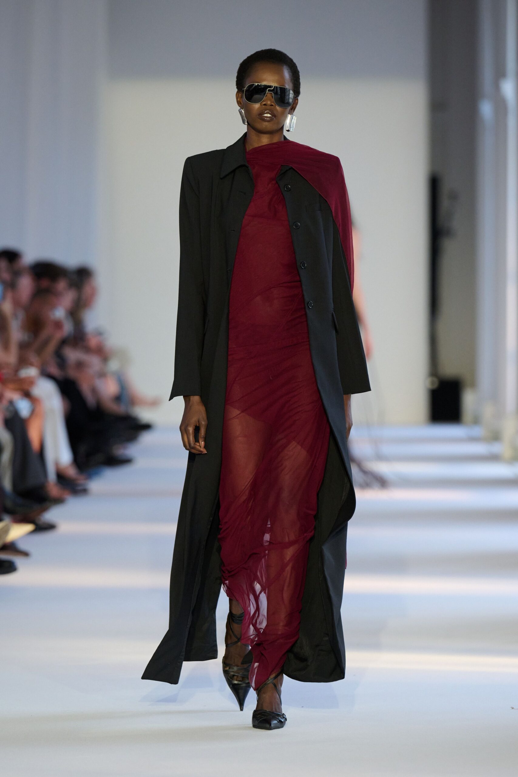 red silk fitted dress with black coat