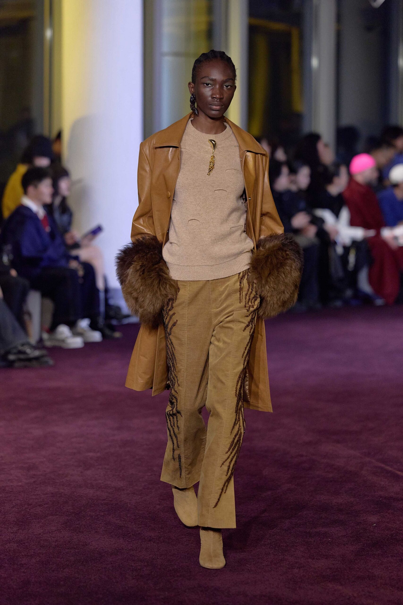 brown leather coat with fringed pants