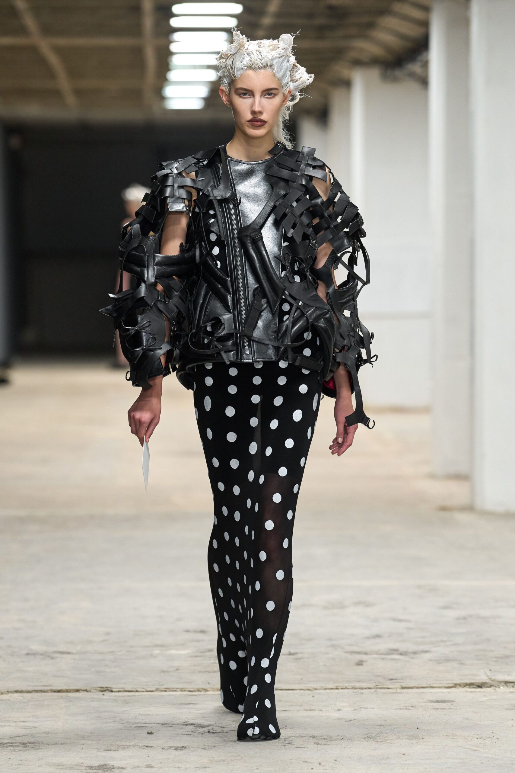 black leather jacket with polka-dot pants
