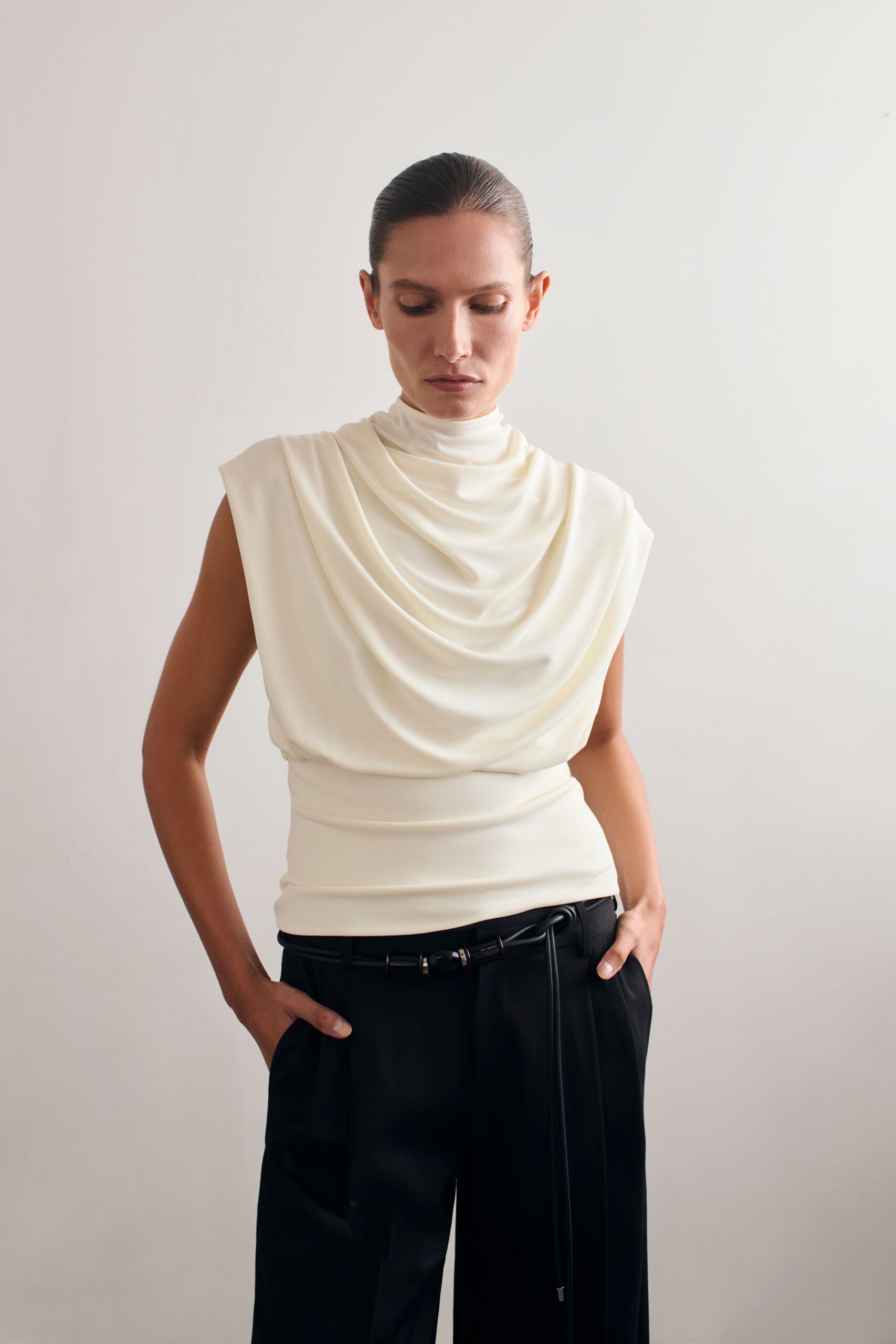 white draped top with black pants