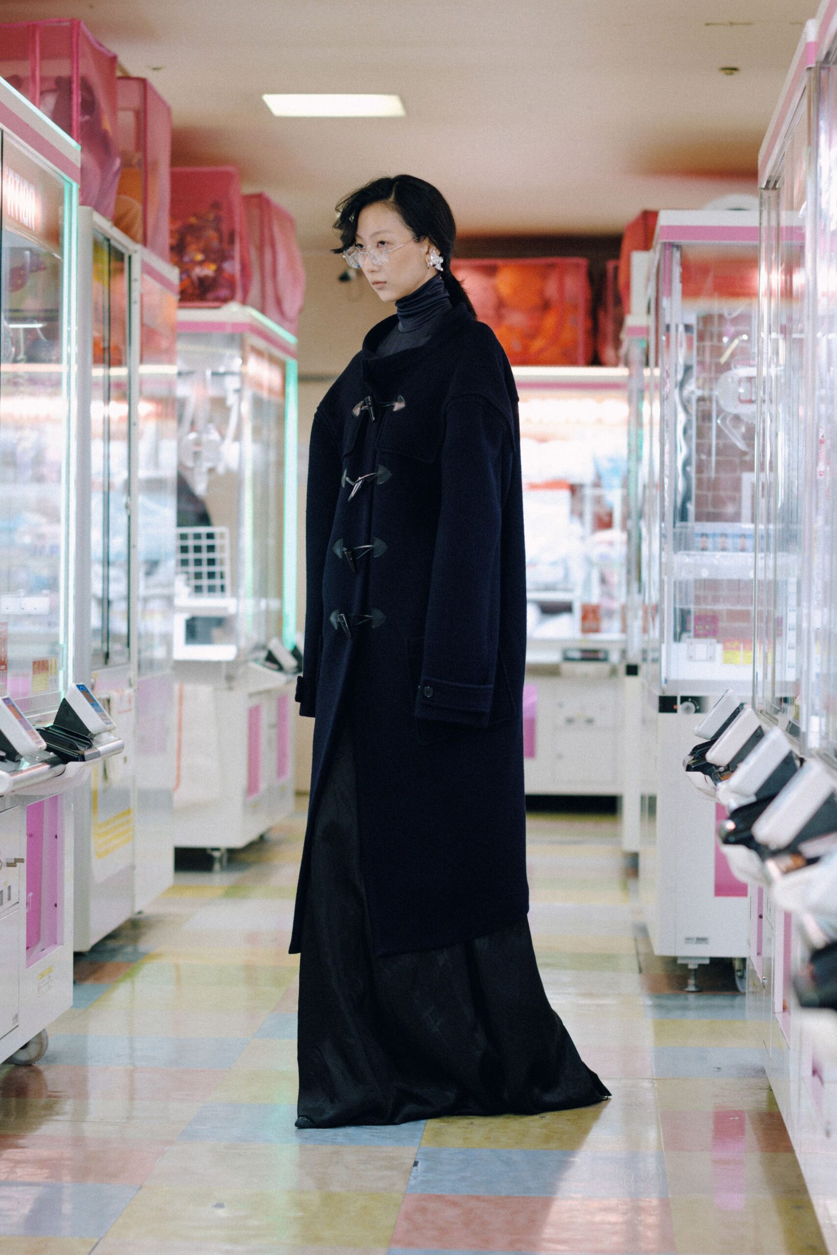 black wool coat and silk gown