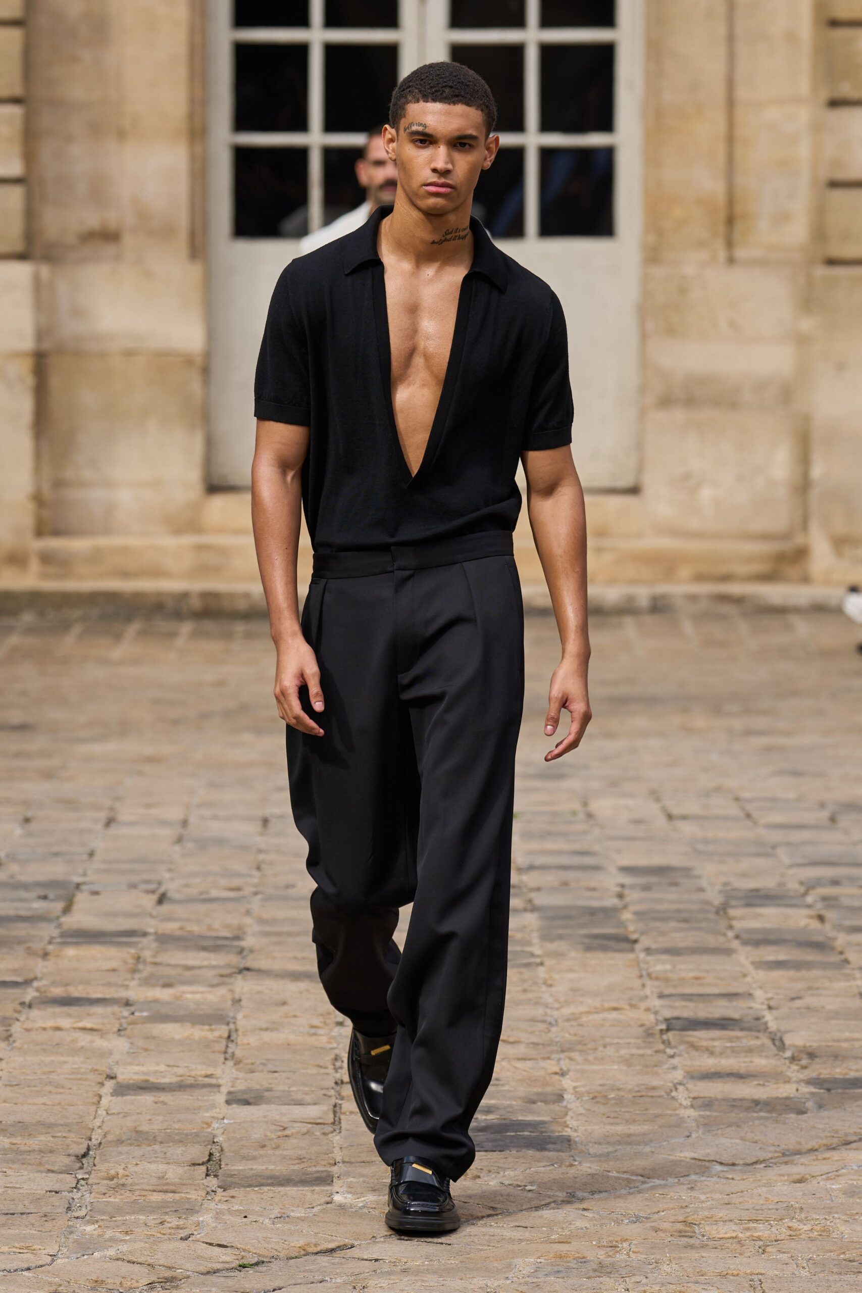 black fitted shirt and relaxed pants