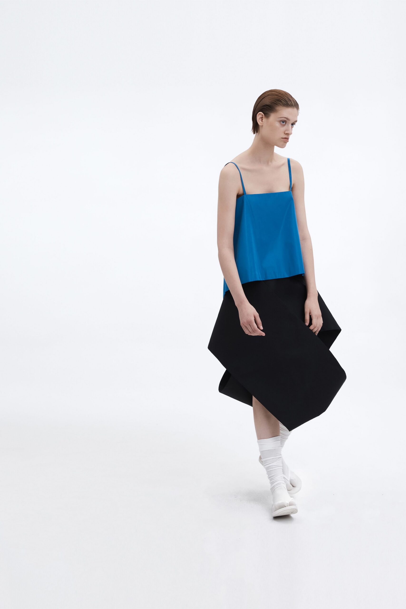 blue top black asymmetric skirt