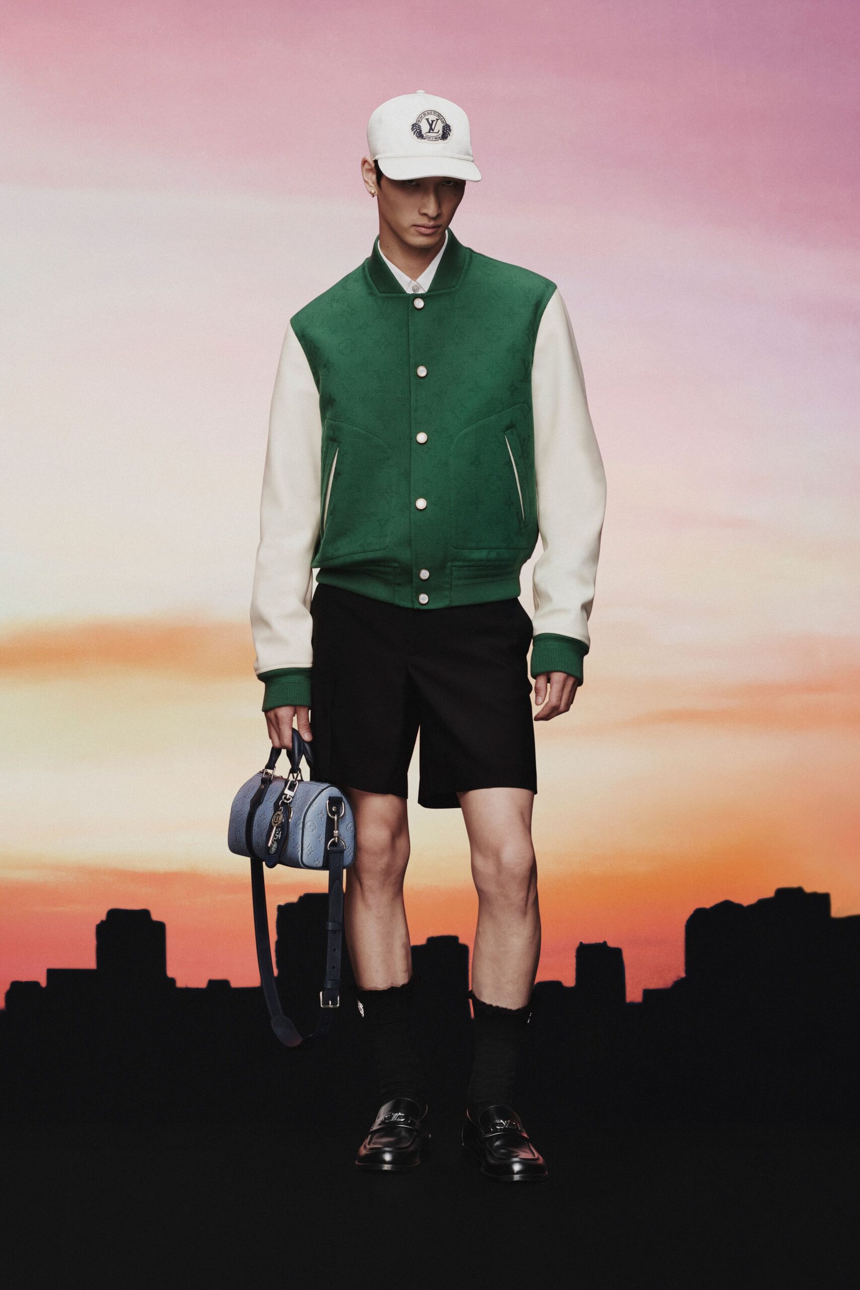 green and white jacket with black shorts