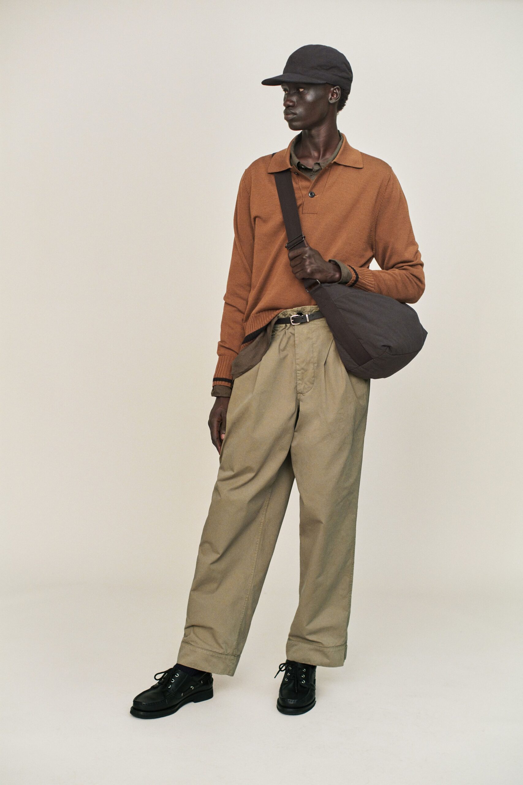 brown relaxed sweater with beige pants