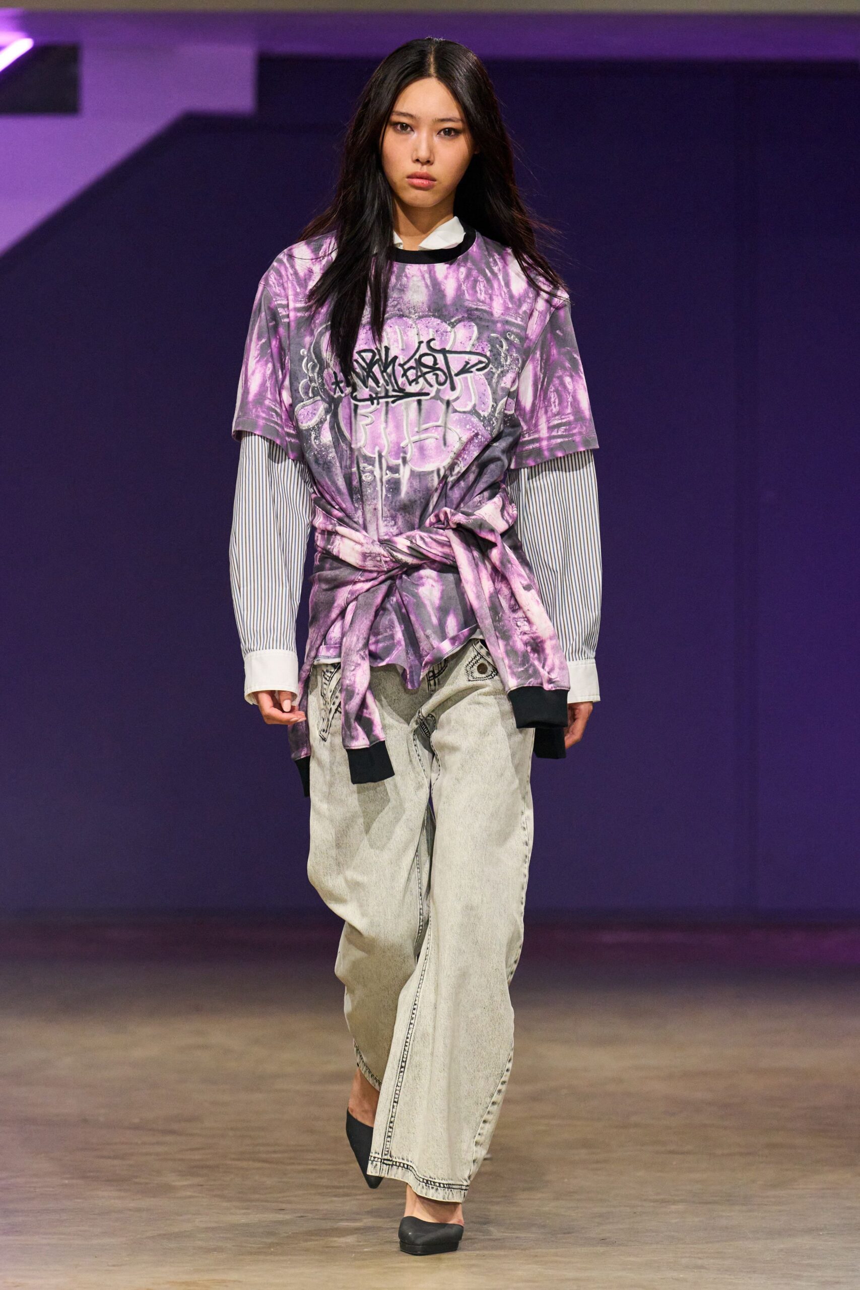 purple printed t-shirt with gray pants