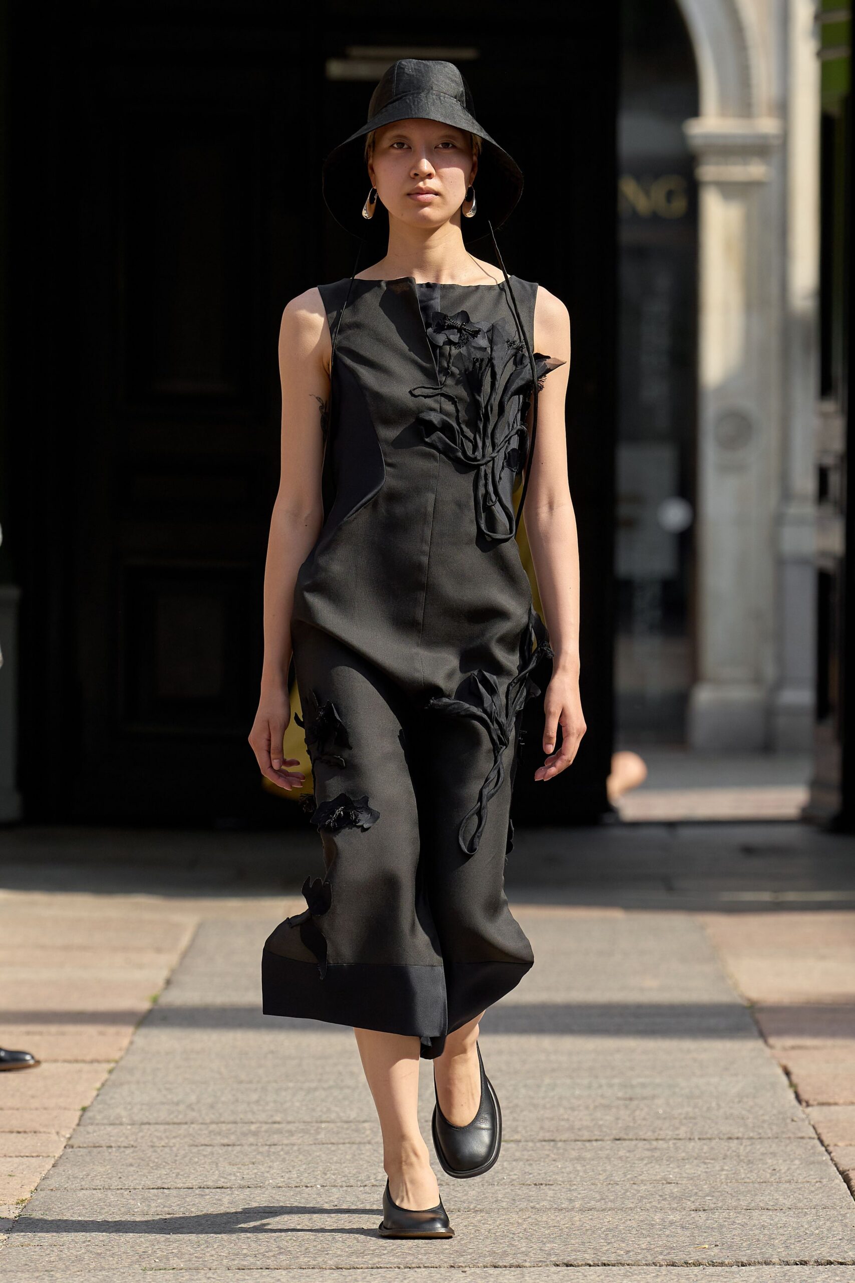 black fitted jumpsuit with hat