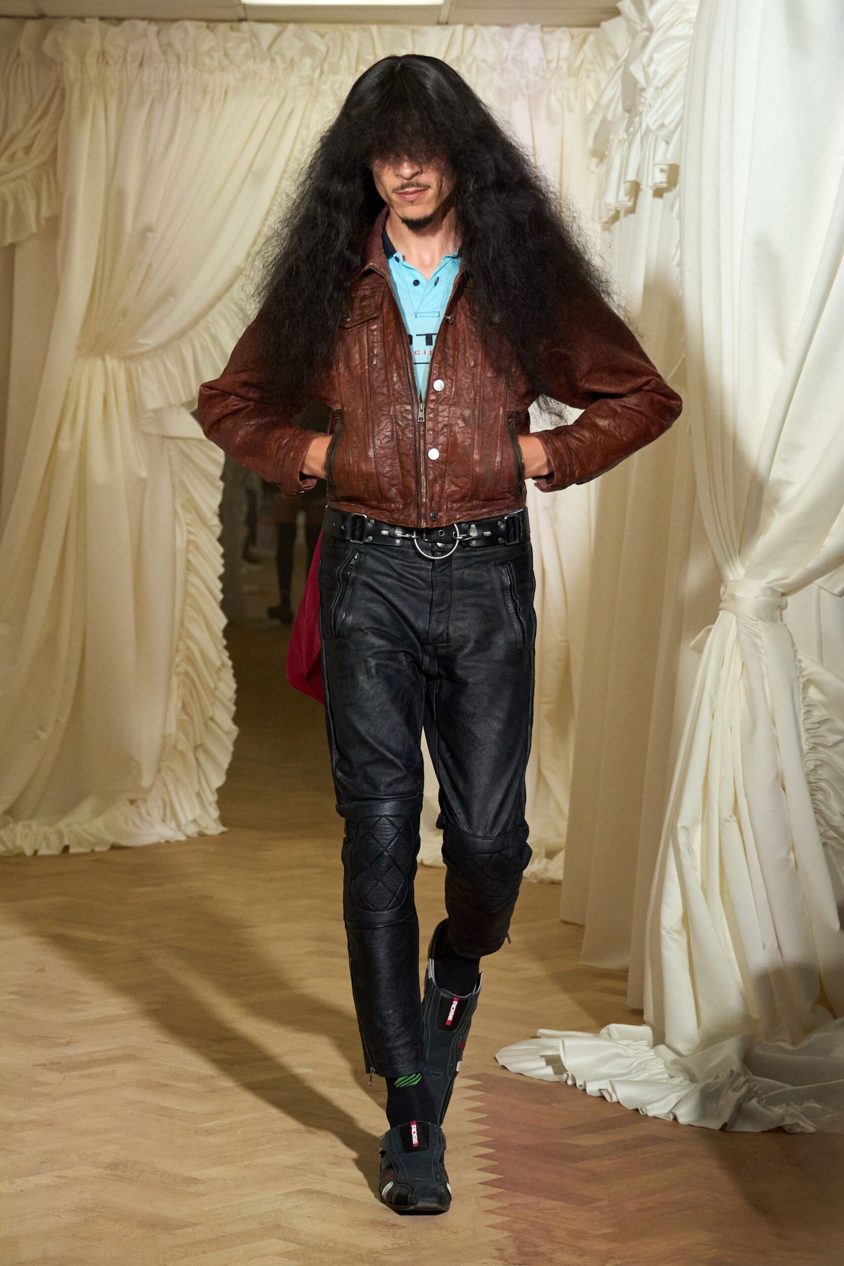 brown leather fitted jacket and black pants