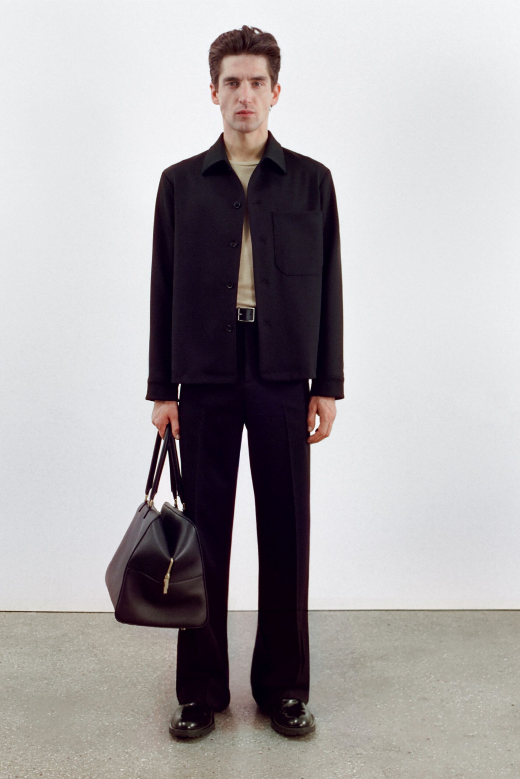 black jacket beige shirt tailored pants
