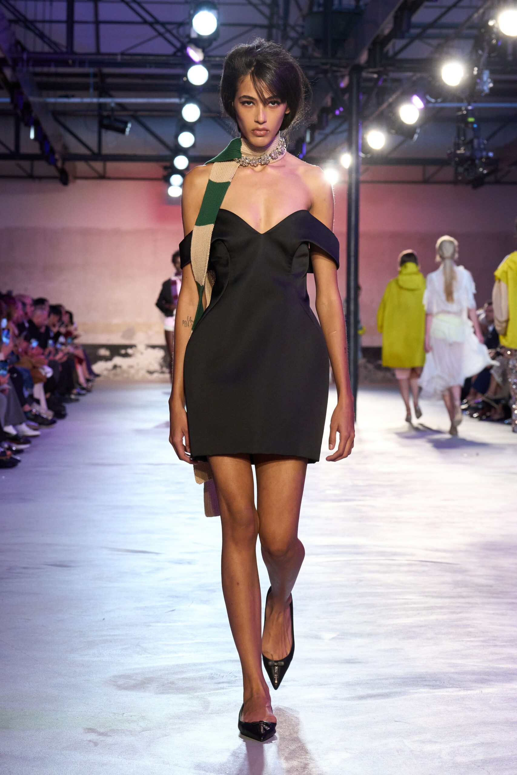 black fitted mini dress with asymmetric detail