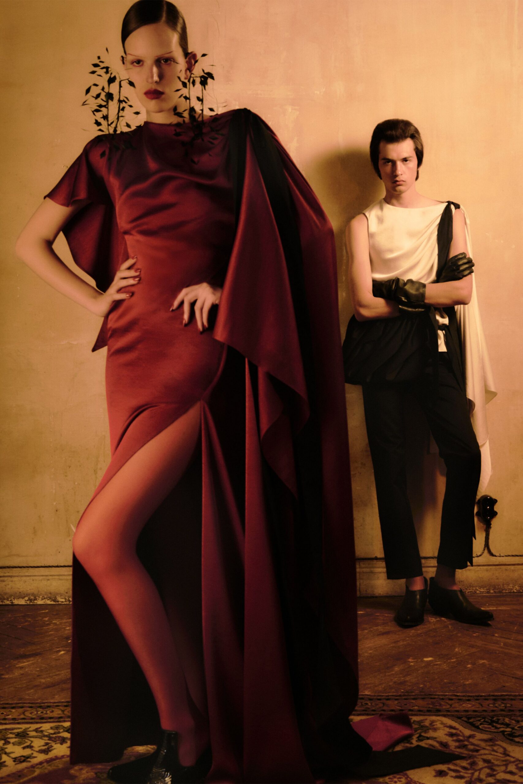 red silk sleeveless high-neck fitted draped flowing gown