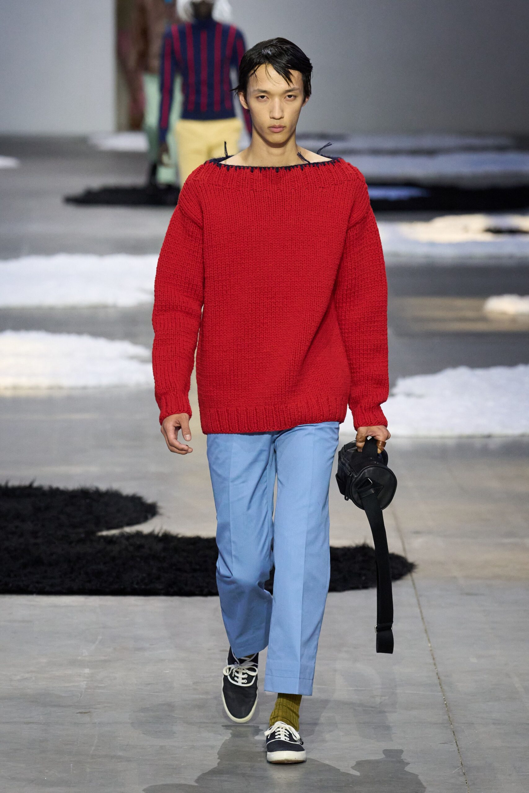 red wool sweater with blue pants