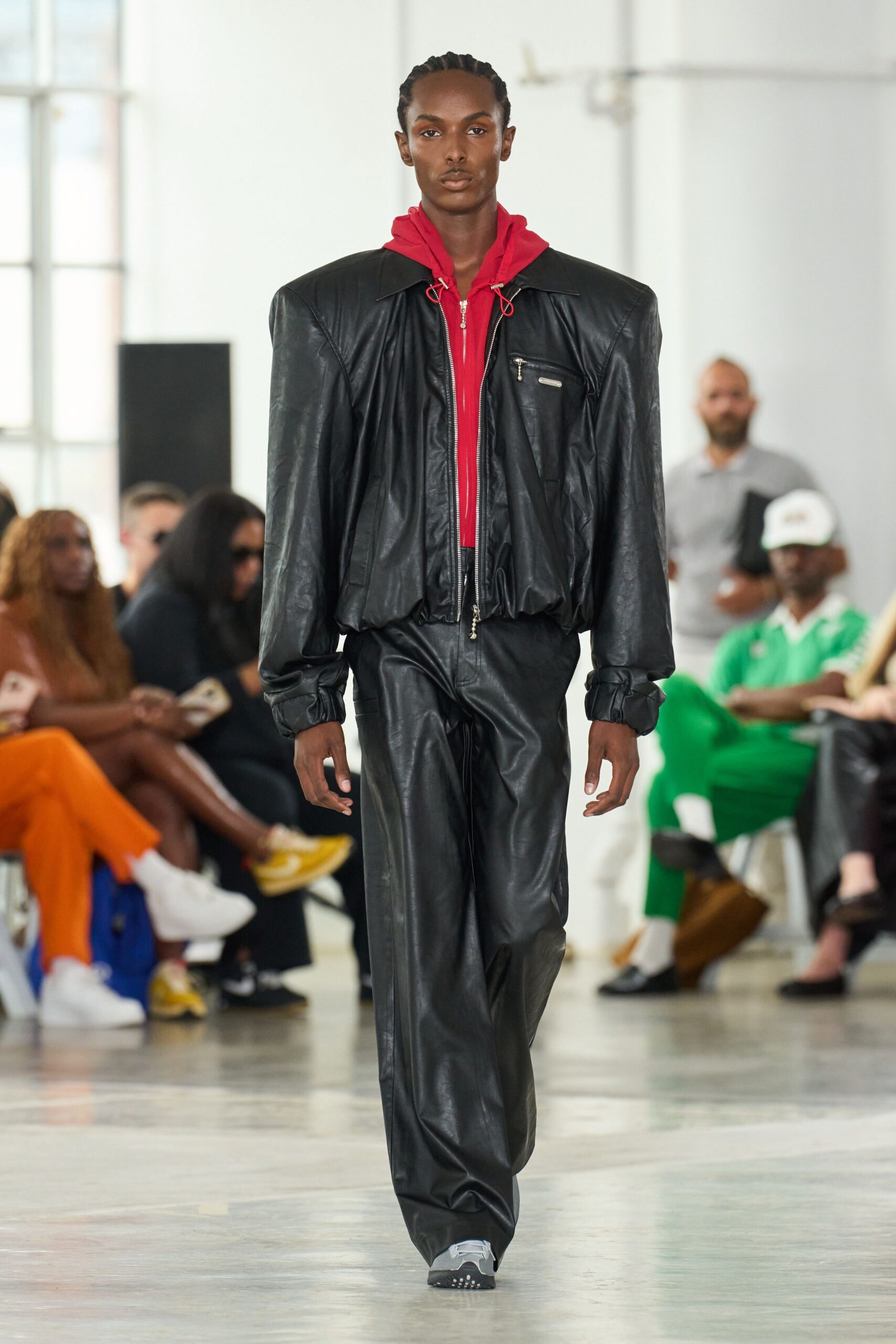 black leather oversized jacket with red hoodie