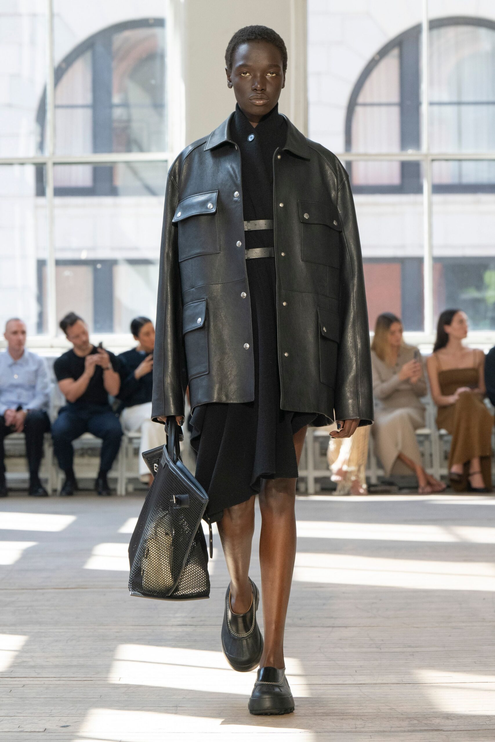 black leather long-sleeve collared relaxed buttoned jacket