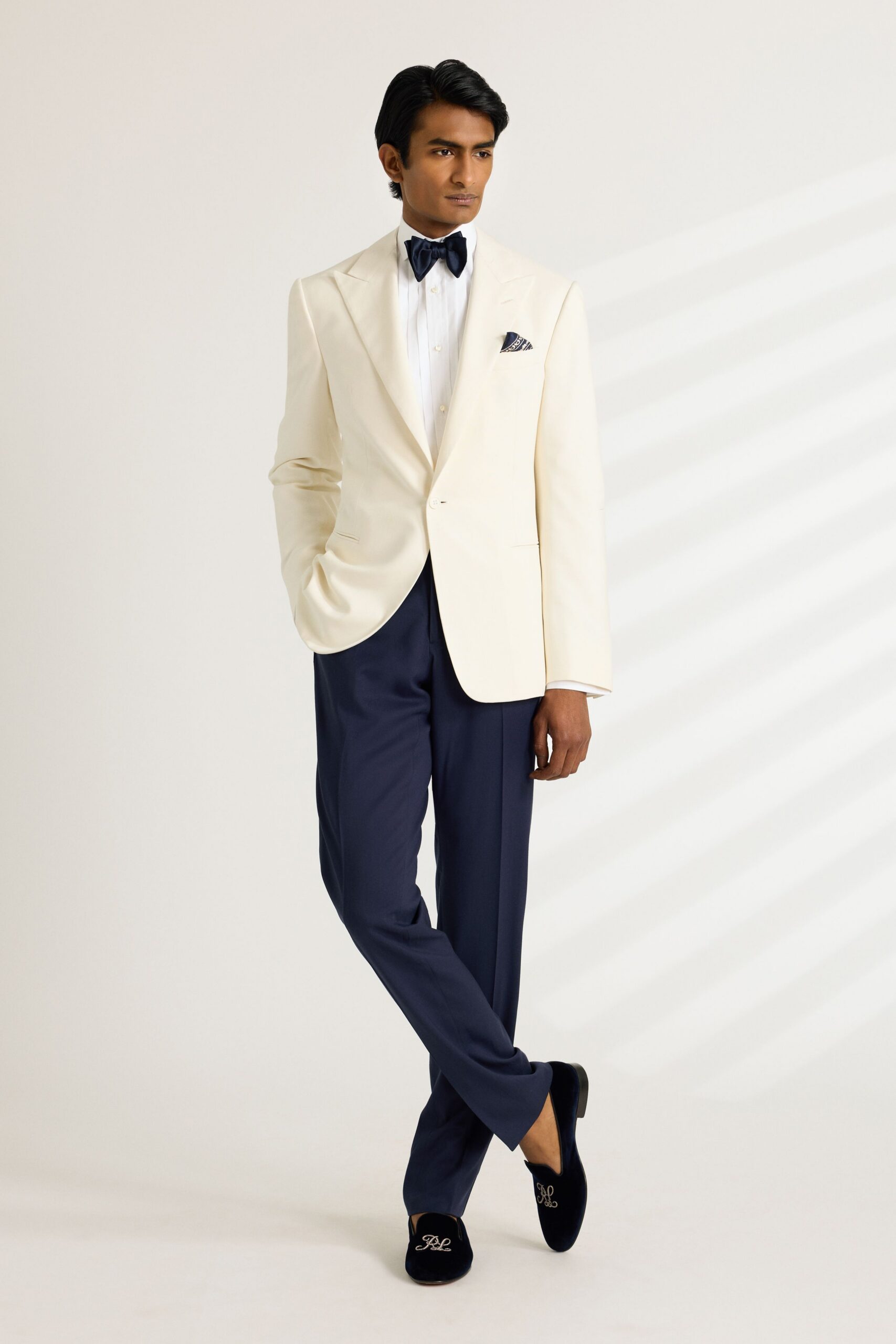 white tailored blazer blue pants