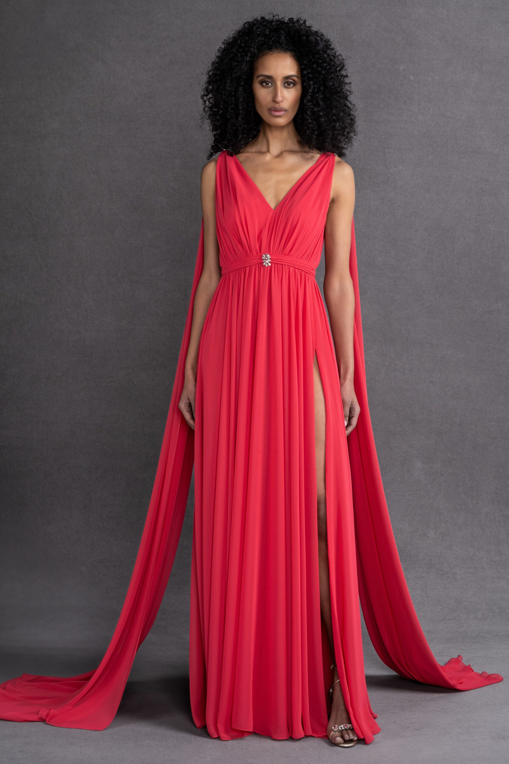 red silk sleeveless v-neck fitted draped belted gown