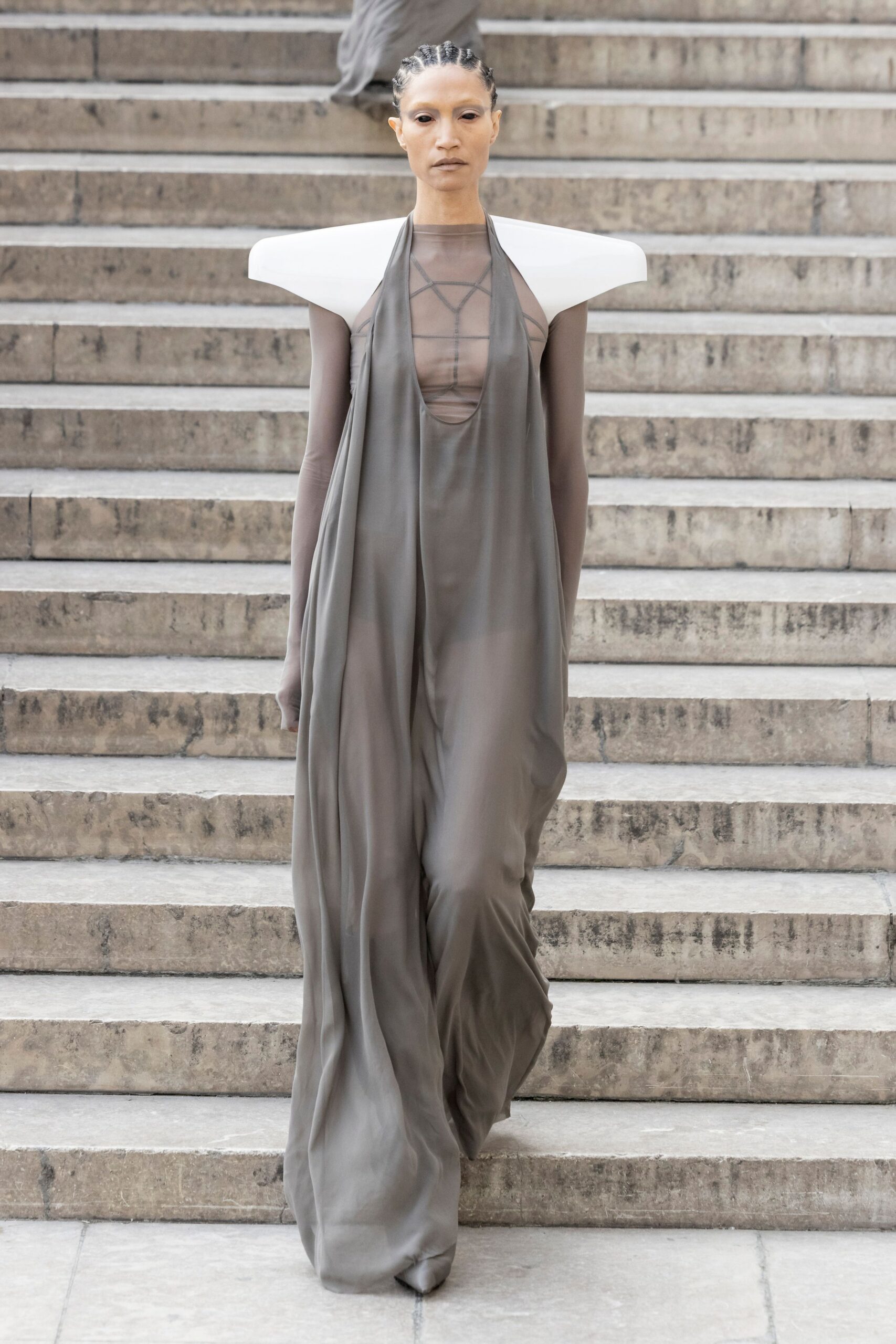 gray flowing sleeveless gown