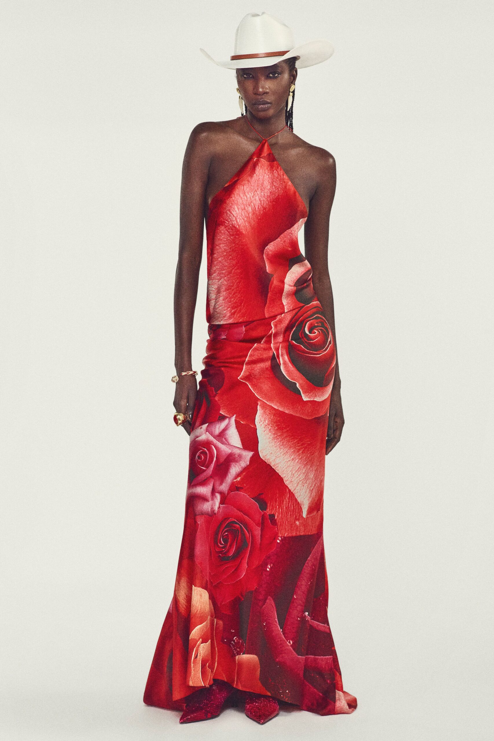 red floral halter gown with white hat