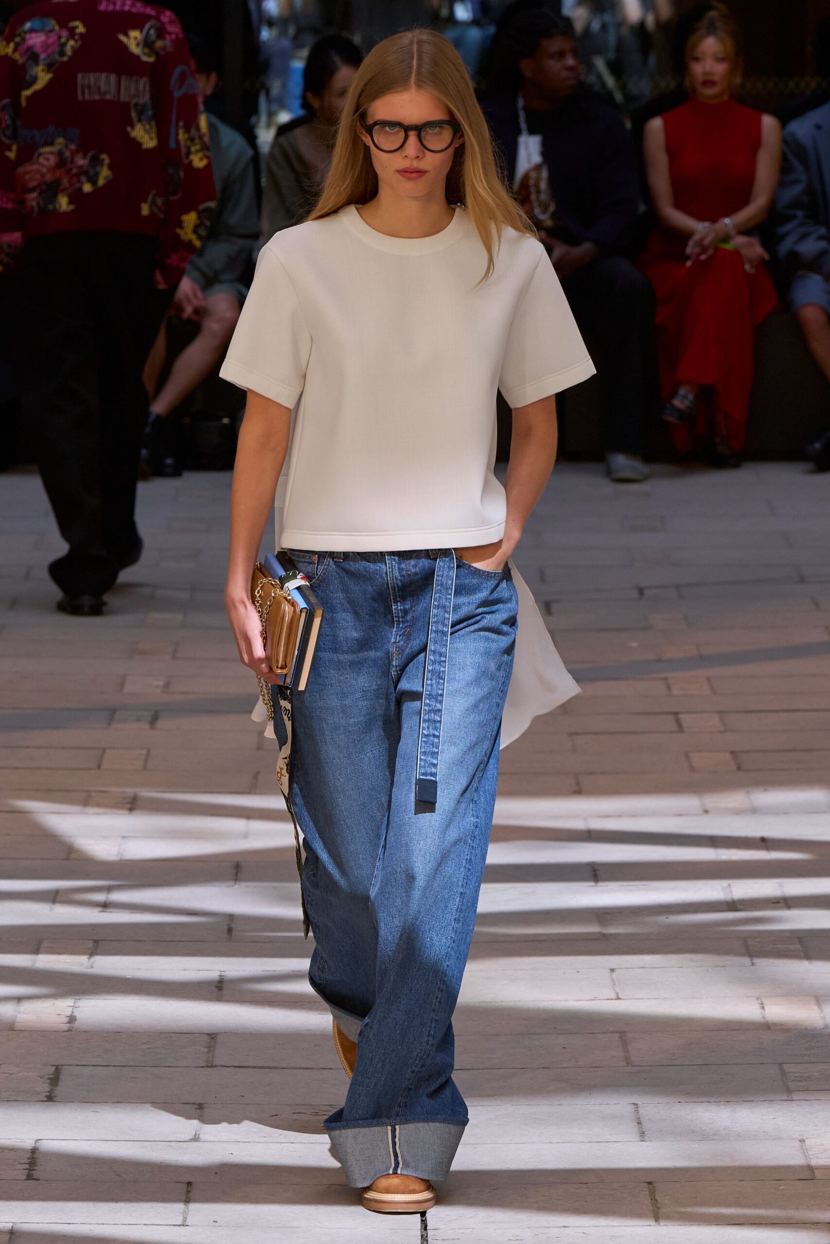 white relaxed top with blue pants