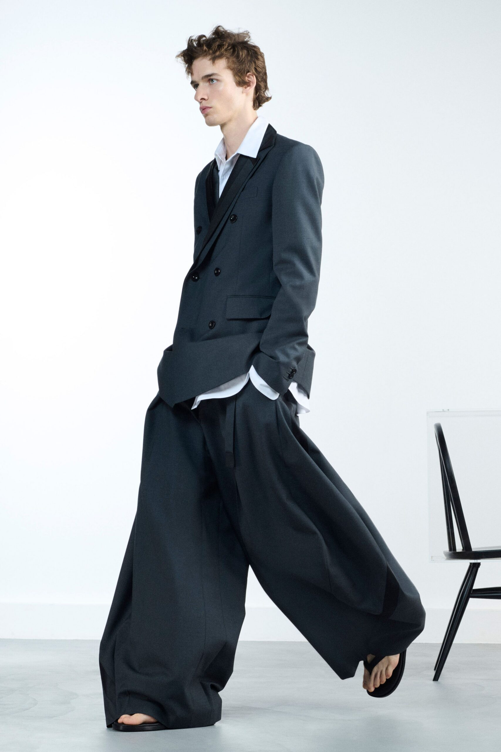 black wool long-sleeve collared relaxed pleated suit