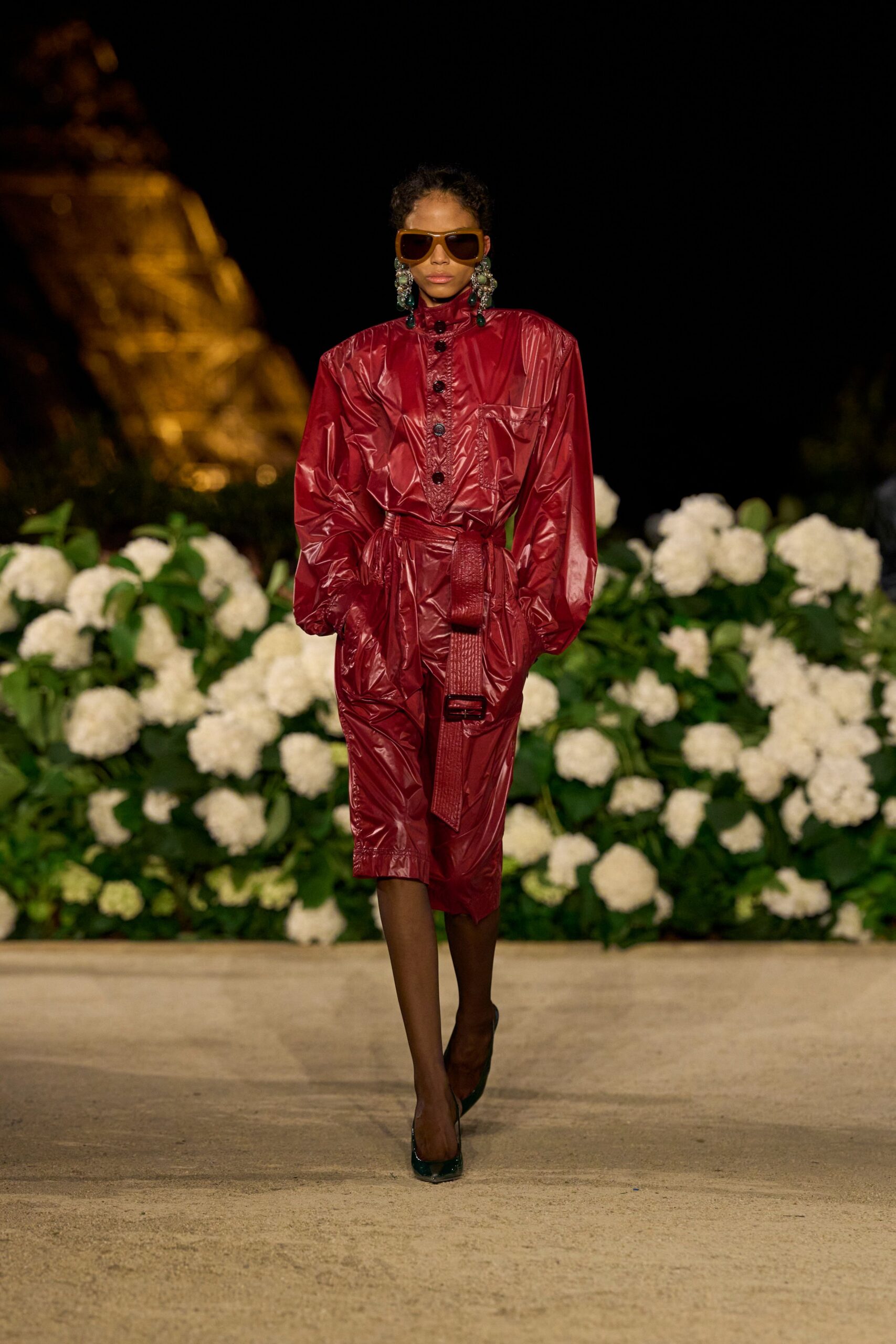 red vinyl long-sleeve collared fitted zippered belted jacket