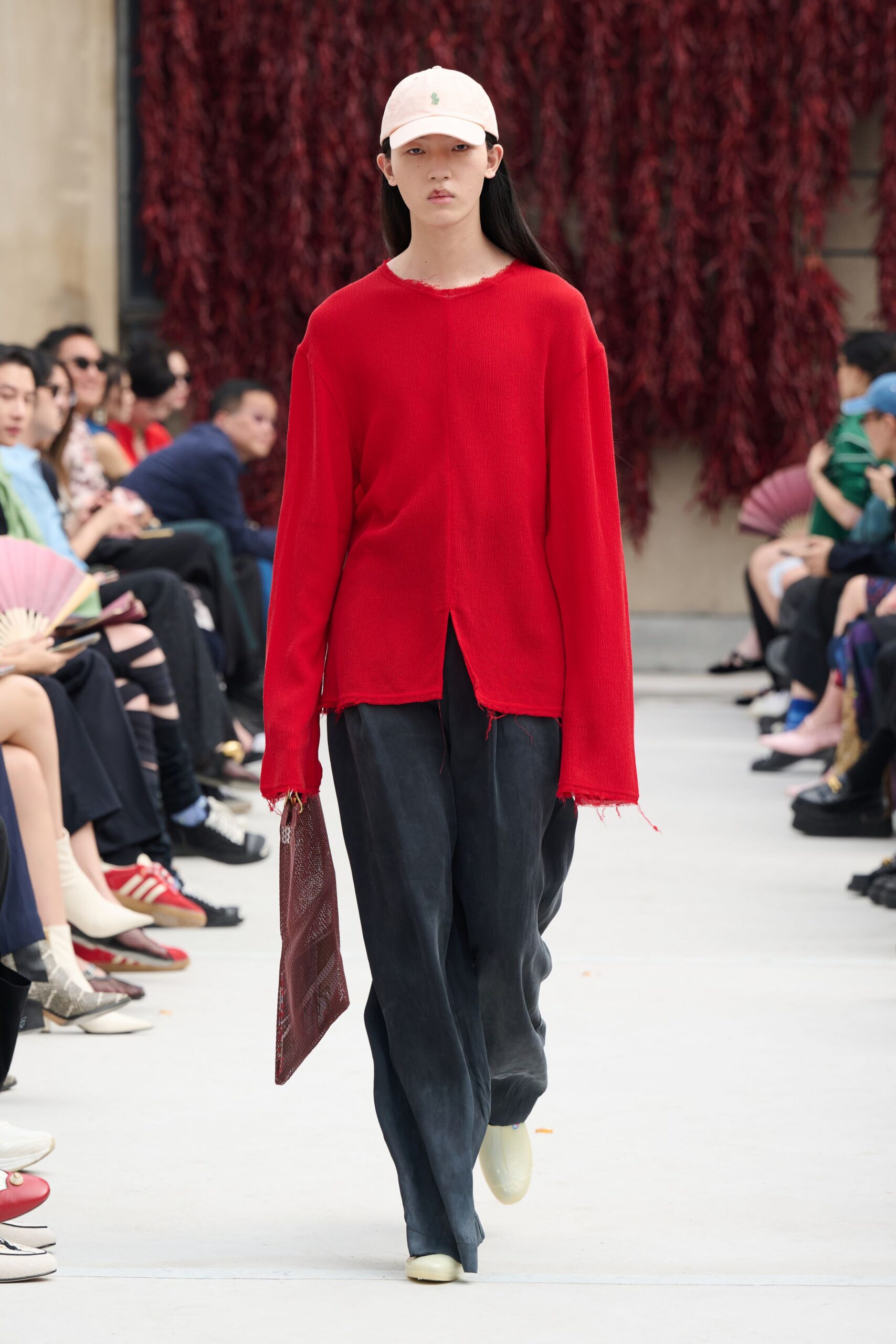 red relaxed top with black pants