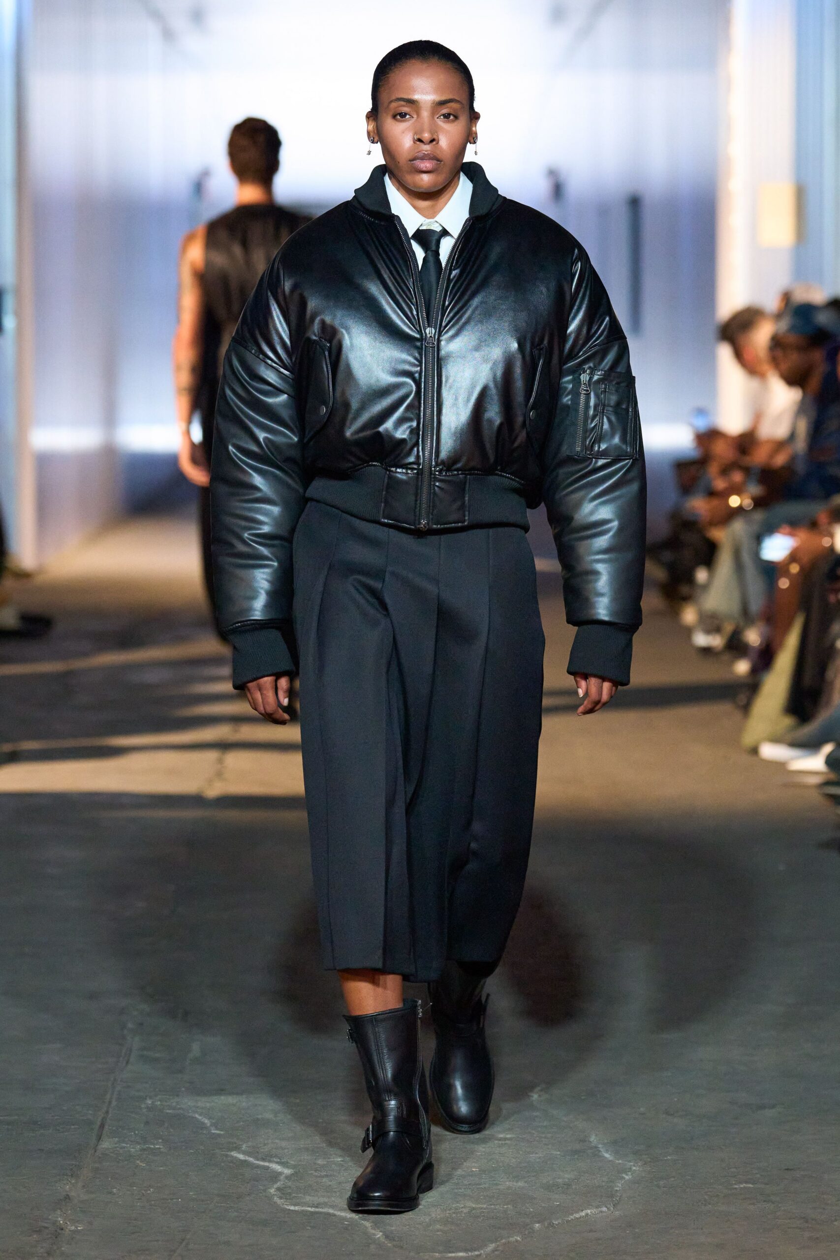 black leather oversized jacket and relaxed pants