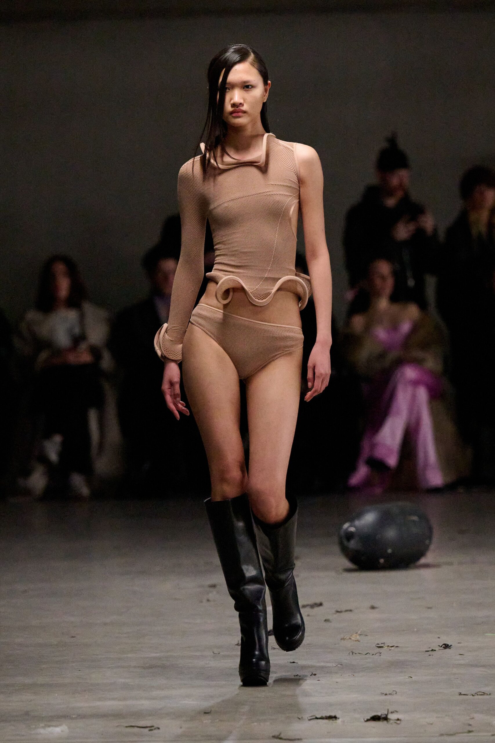 beige fitted bodysuit with black boots
