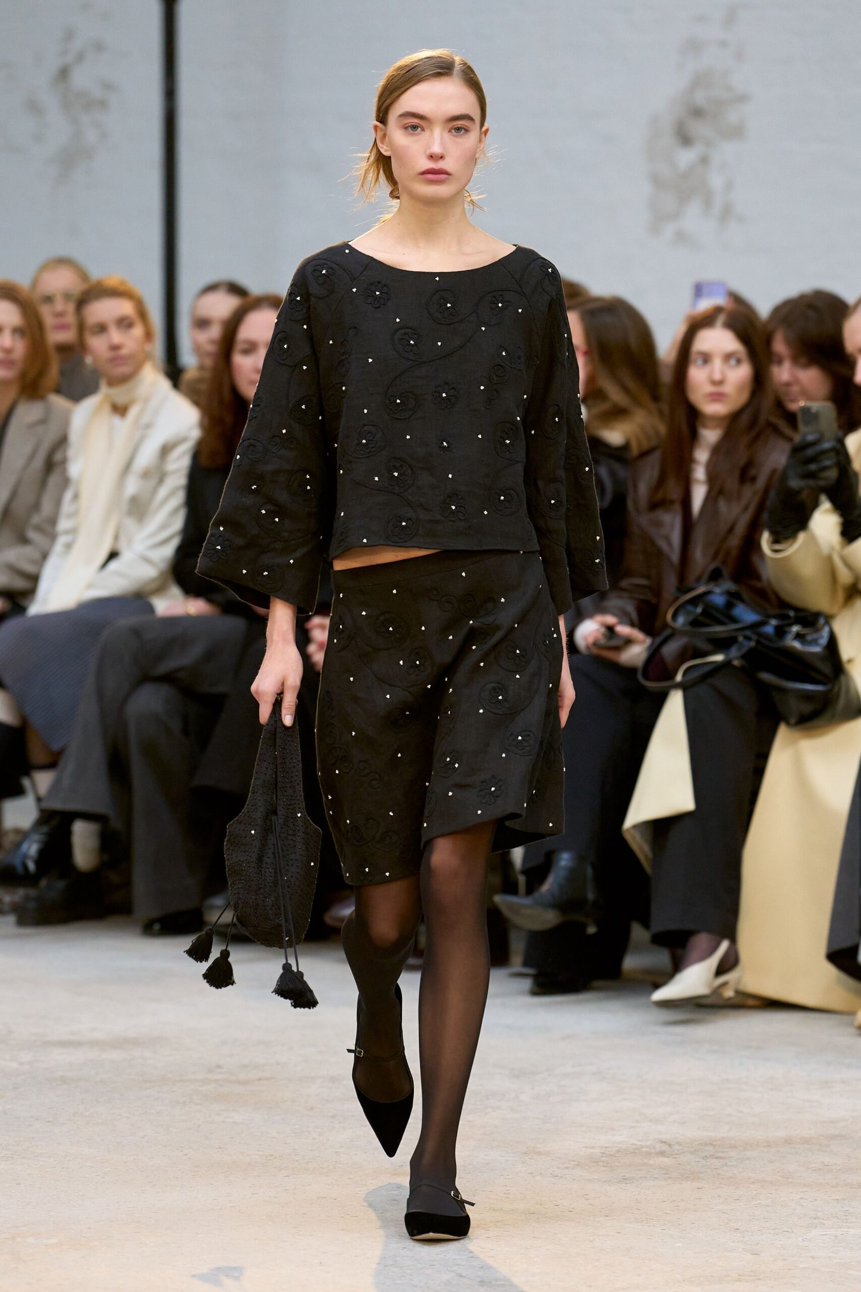black embroidered top and skirt