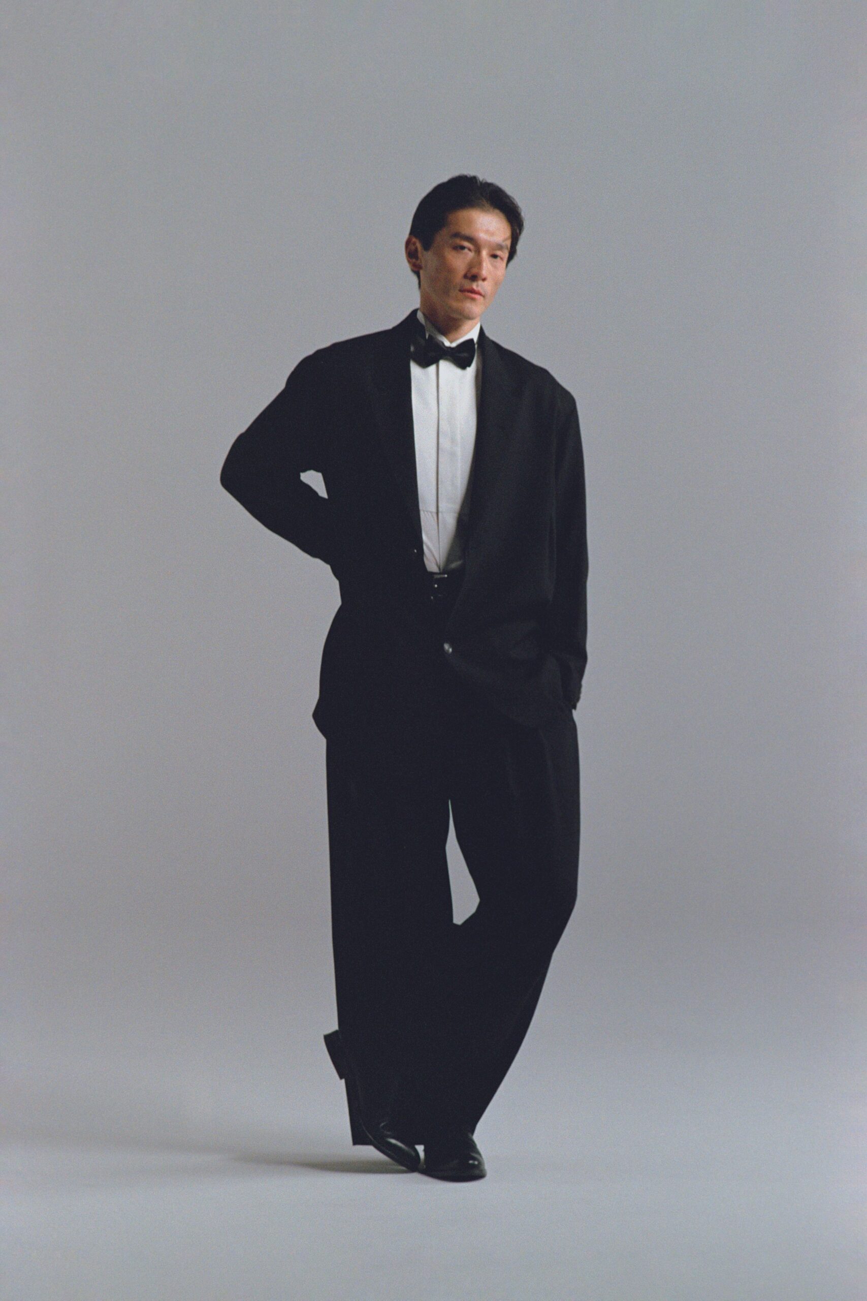 black tailored suit with relaxed pants