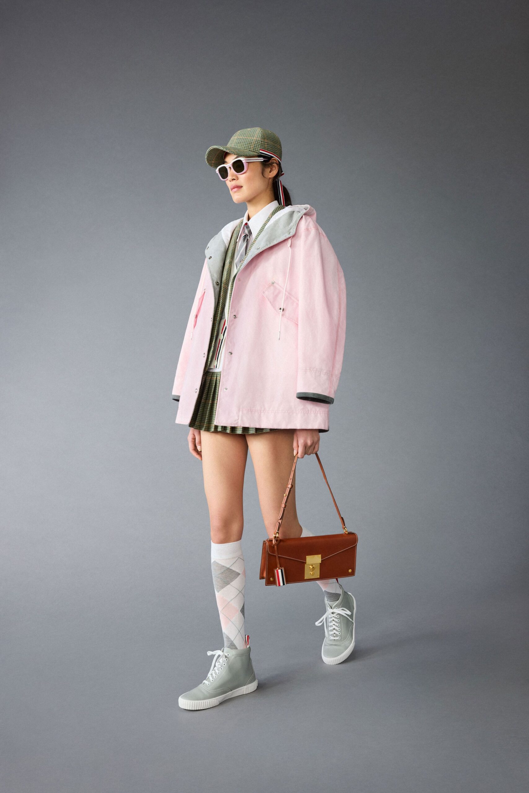 pink jacket gray shirt green skirt