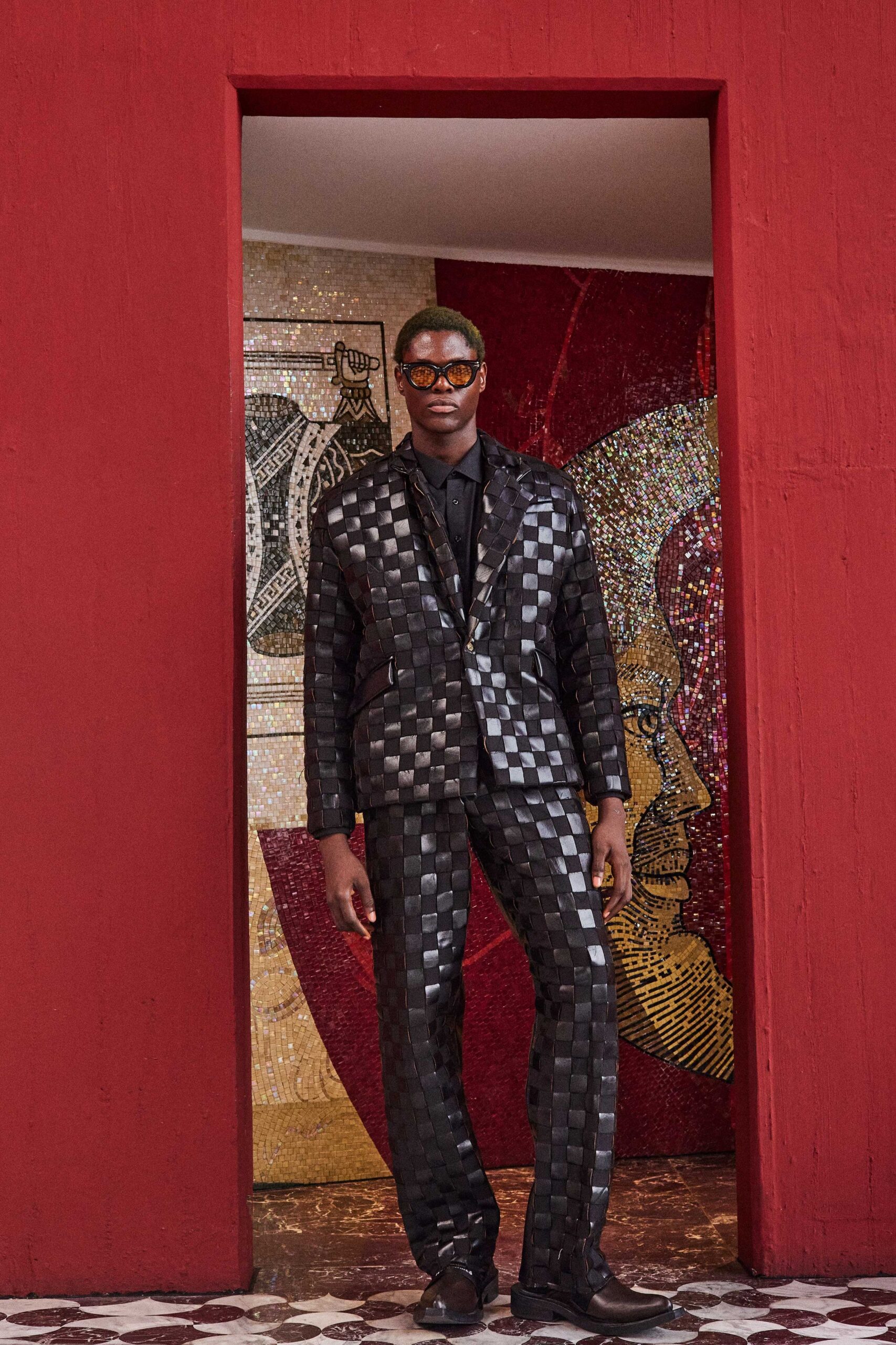 black tailored suit with sunglasses