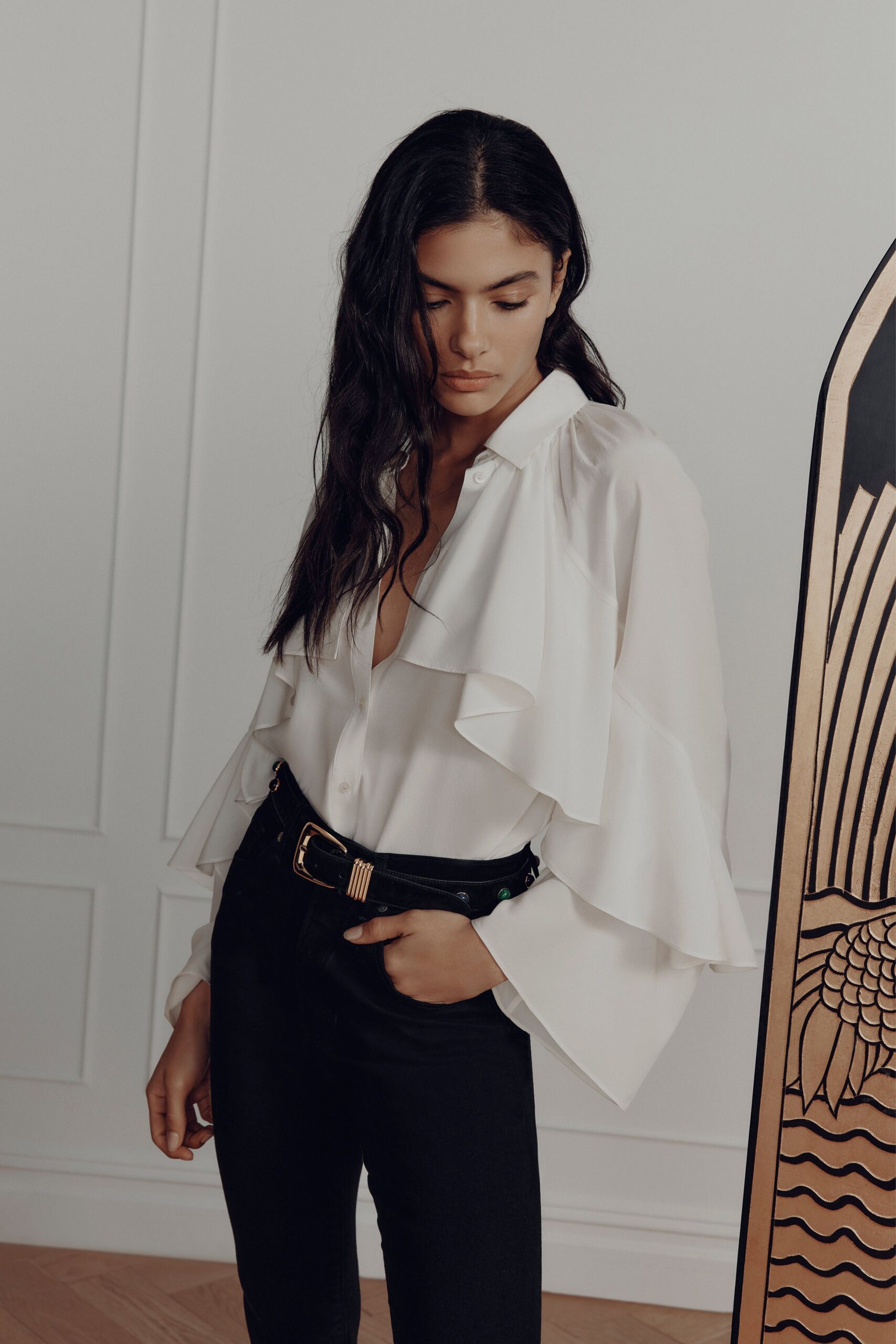 white ruffled shirt with black pants